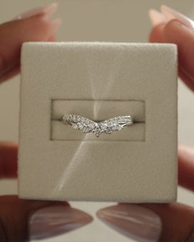 0.27 TCW round cut moissanite wedding band in a crown-inspired design β dainty and elegant ring crafted in polished gold, ideal for bridal stacking.