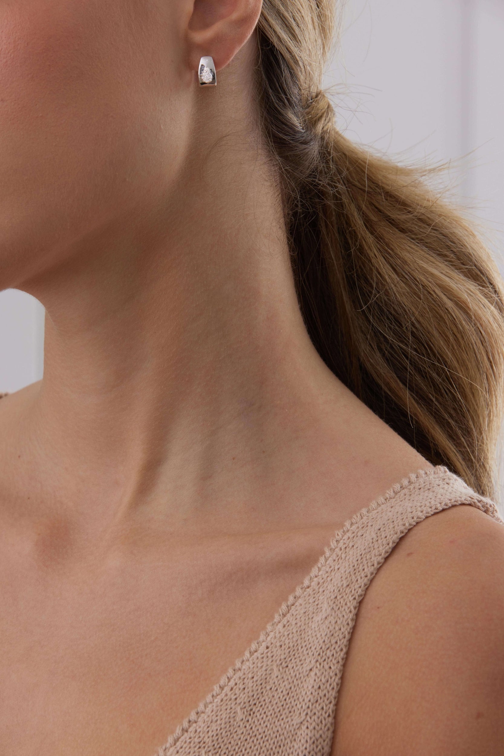 0.14 TCW Round Moissanite Diamond Huggie Earrings - crownmoissanite