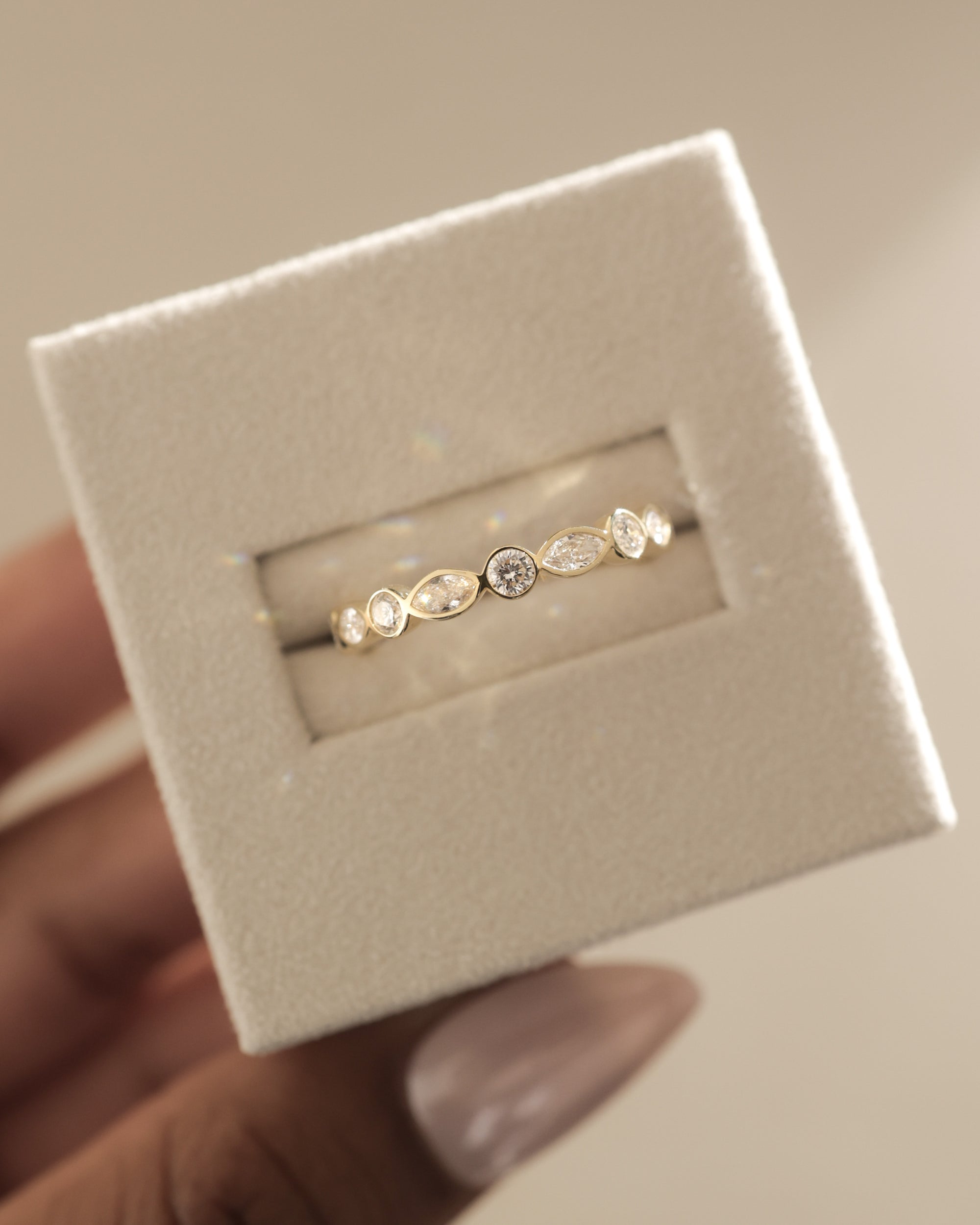 1.15 TCW round and marquise cut moissanite wedding band with bezel setting – modern gold ring featuring alternating shapes for a unique and elegant bridal look.