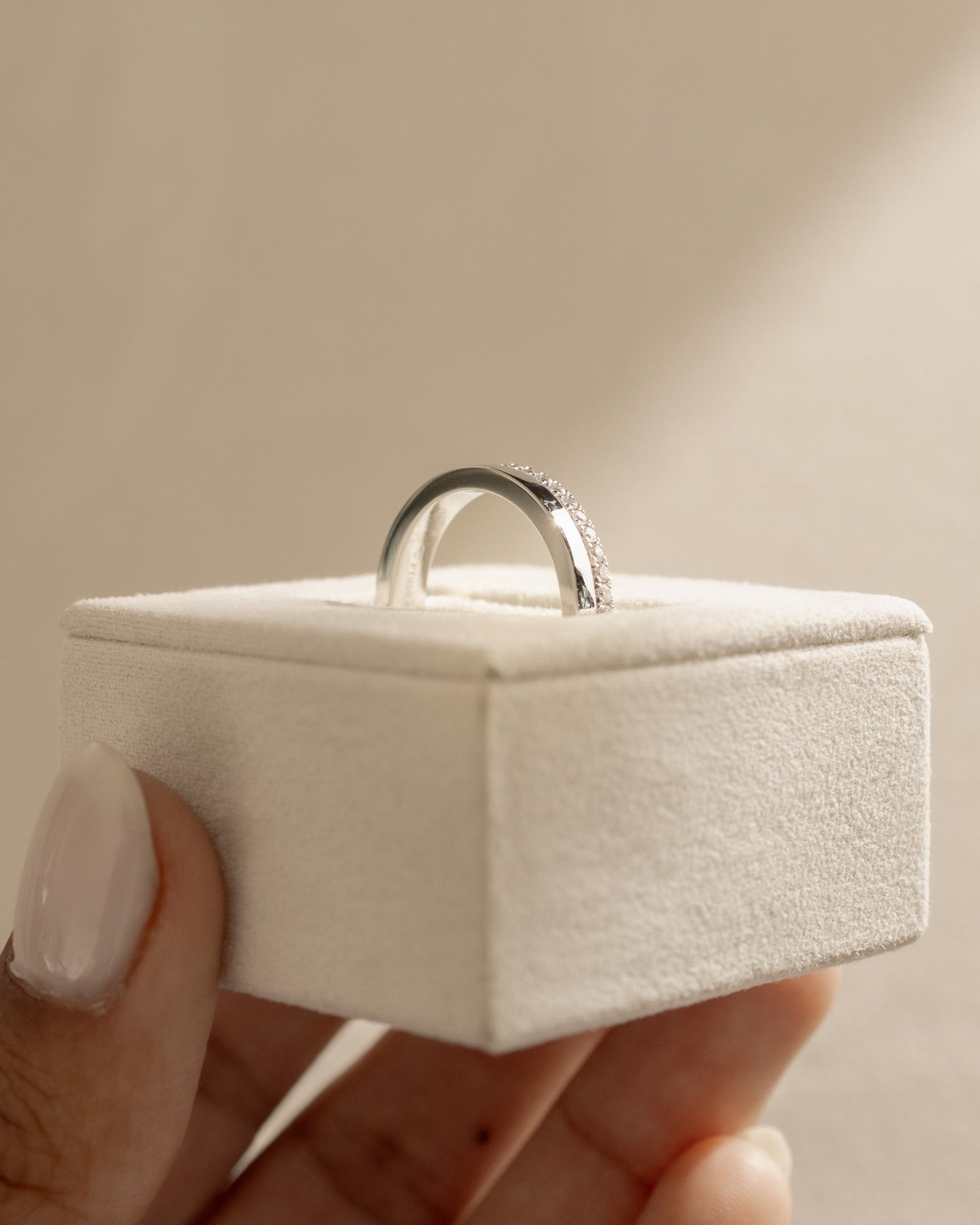 0.21 TCW round cut moissanite pavé wedding band in a bold cigar-style design – wide gold band with delicate sparkle, perfect for modern bridal or statement wear.