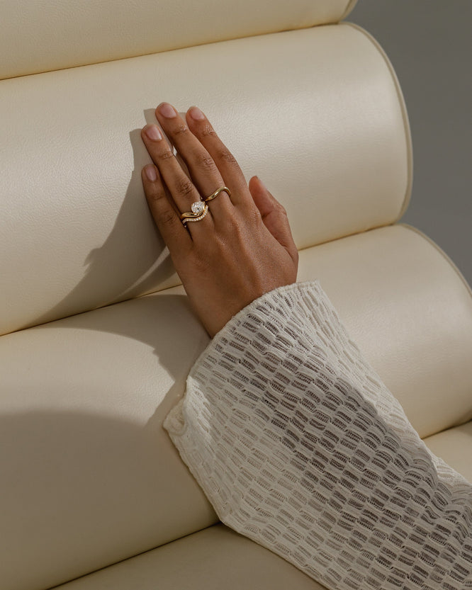 0.26 TCW round moissanite half eternity wedding band in a wavy design β elegant bridal ring in polished gold, perfect for stacking or wearing solo.