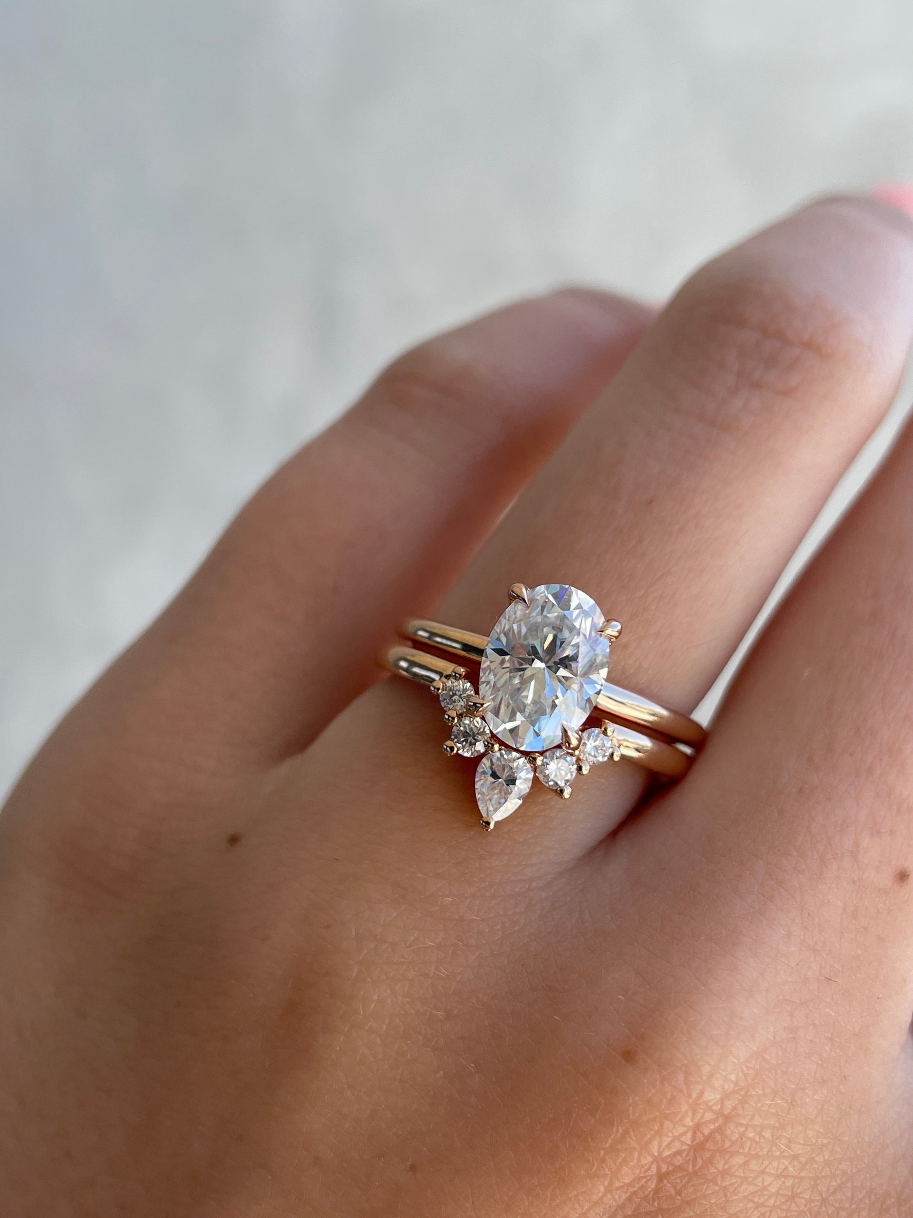 0.37 TCW moissanite bridal wedding band featuring round and pear cut stones in a crown-inspired design – elegant, sparkling ring crafted in polished gold.