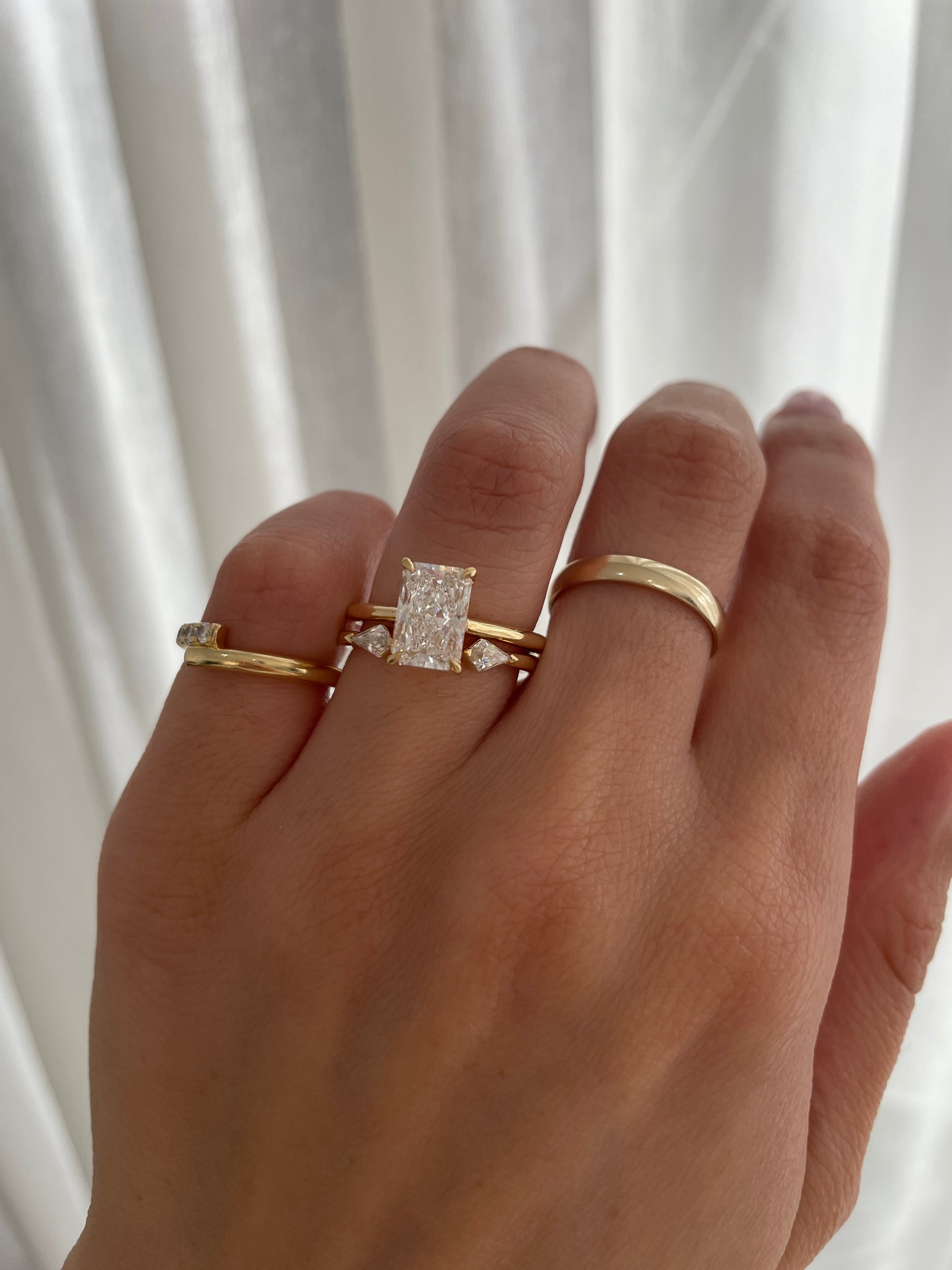 0.4 TCW kite cut moissanite open-style wedding band – contemporary and edgy design in polished gold, perfect for stacking or pairing with statement engagement rings.