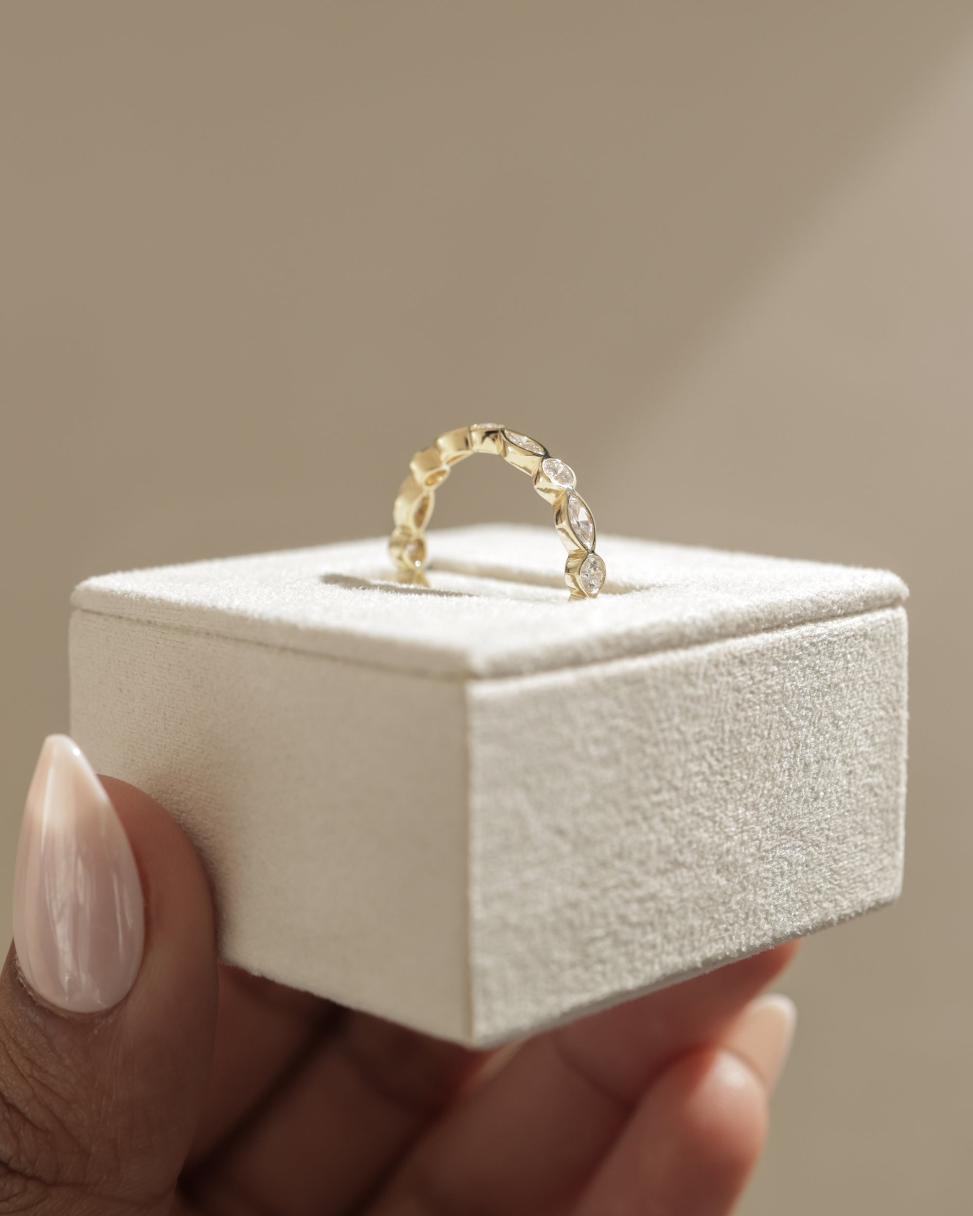 1.15 TCW round and marquise cut moissanite wedding band with bezel setting – modern gold ring featuring alternating shapes for a unique and elegant bridal look.