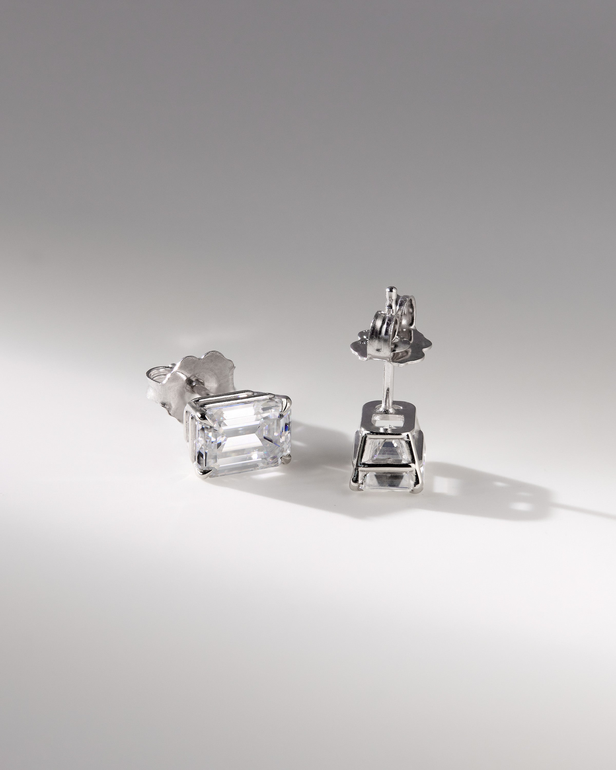 2.00 TCW emerald cut moissanite stud earrings – timeless and elegant diamond alternative set in polished gold, perfect for everyday luxury or special occasions.