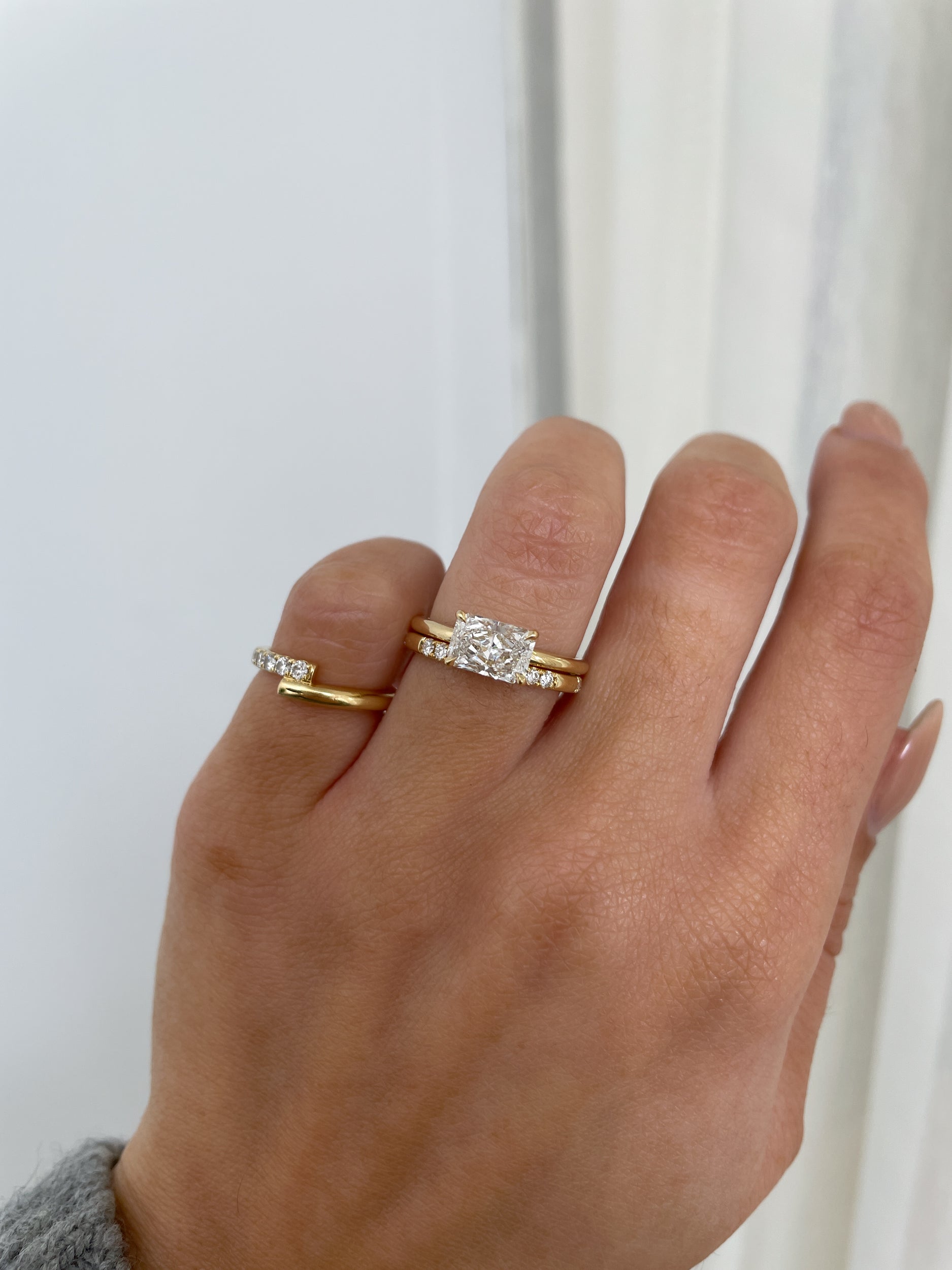 0.31 TCW round cut moissanite wedding band in a clustered pavé setting – delicate and sparkling gold band, perfect for bridal stacking or everyday elegance.