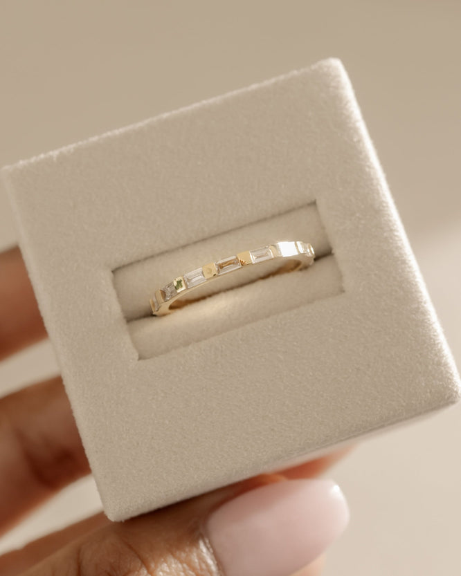 0.32 TCW baguette cut moissanite half eternity wedding band β sleek and modern gold ring featuring step-cut stones, perfect for stacking or contemporary bridal wear.