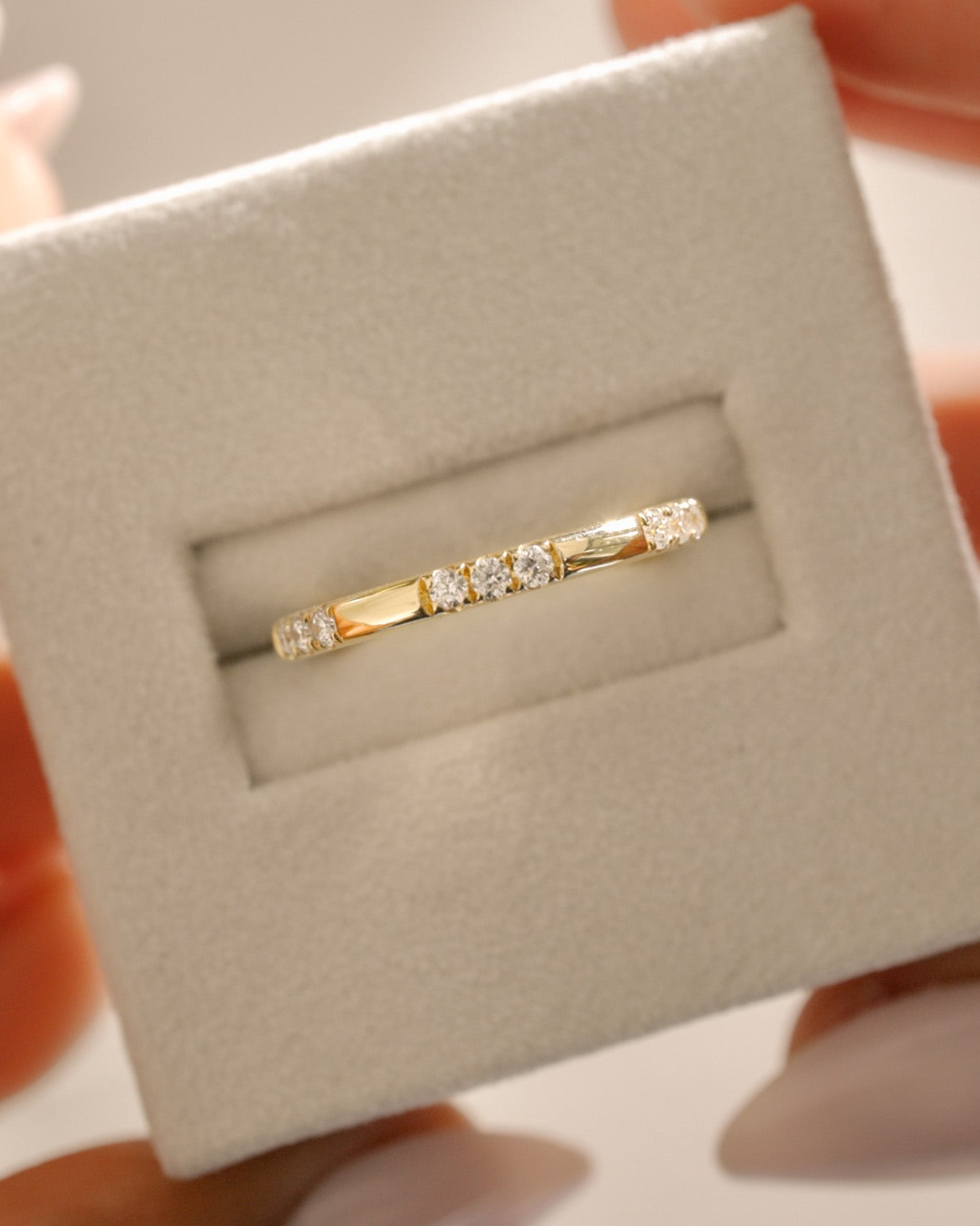 0.31 TCW round cut moissanite wedding band in a clustered pavé setting – delicate and sparkling gold band, perfect for bridal stacking or everyday elegance.