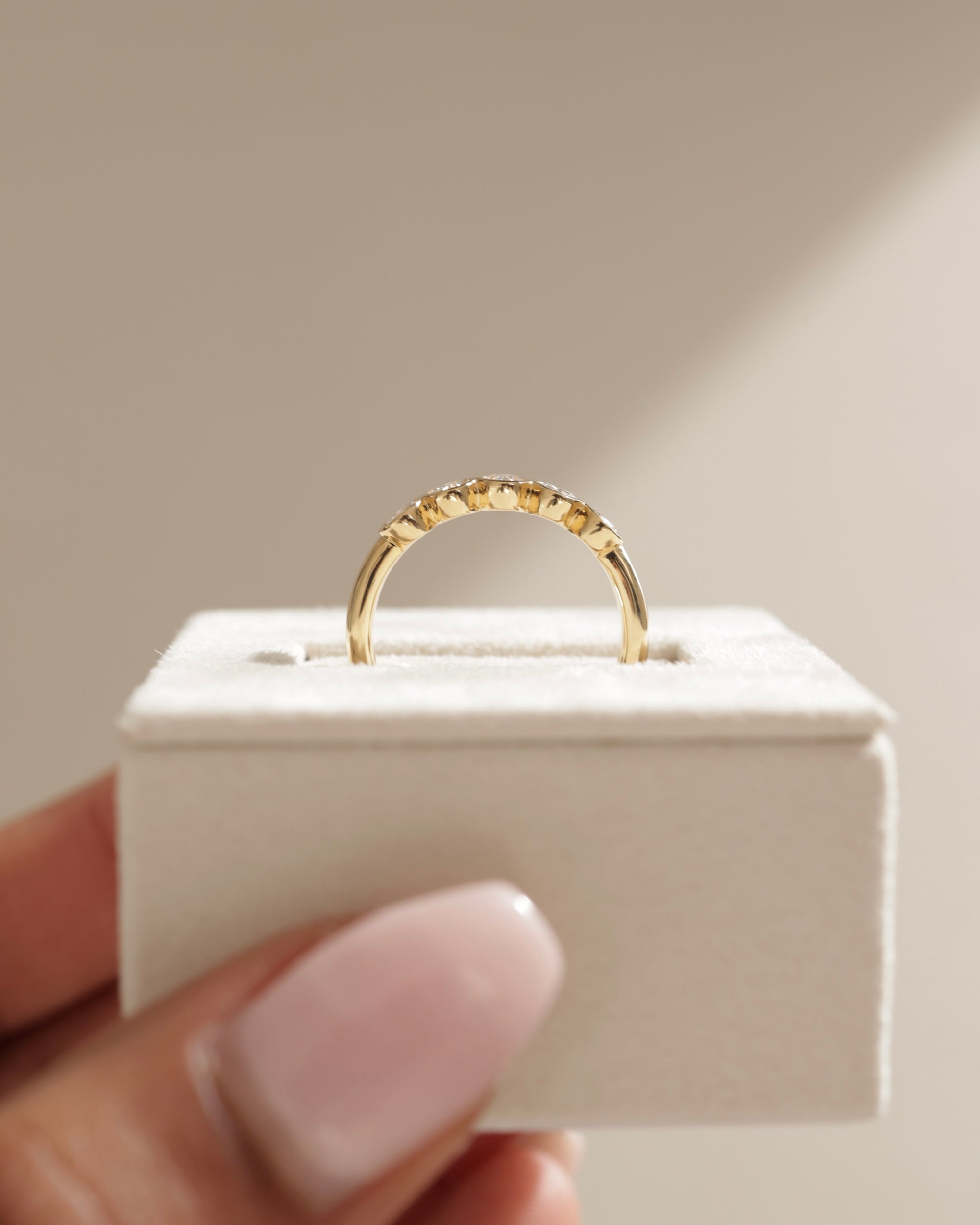 0.75 TCW oval cut moissanite wedding band with bezel setting – elegant and modern gold band offering secure sparkle, perfect for everyday elegance or bridal stacking.