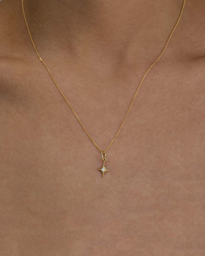 1.0 CT round cut moissanite star necklace β sparkling gold pendant featuring a brilliant stone in a celestial star design, perfect for gifting or everyday elegance.