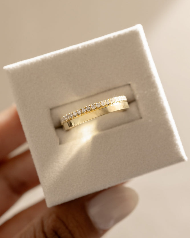 0.21 TCW round cut moissanite pavΓ© wedding band in a bold cigar-style design β wide gold band with delicate sparkle, perfect for modern bridal or statement wear.