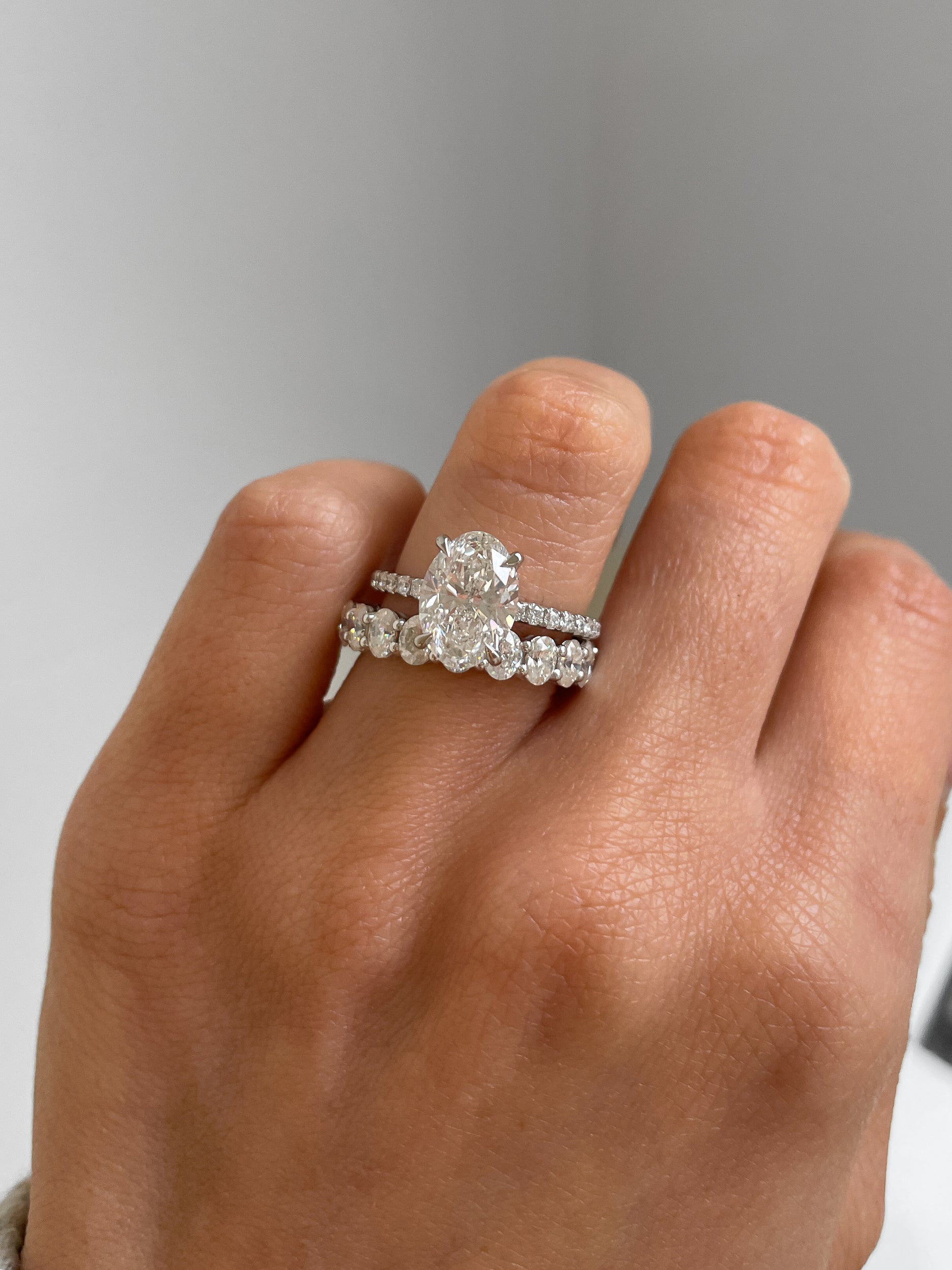 1.35 TCW oval cut moissanite half eternity wedding band – elegant and timeless design crafted in polished gold, perfect for bridal stacking or solo wear.