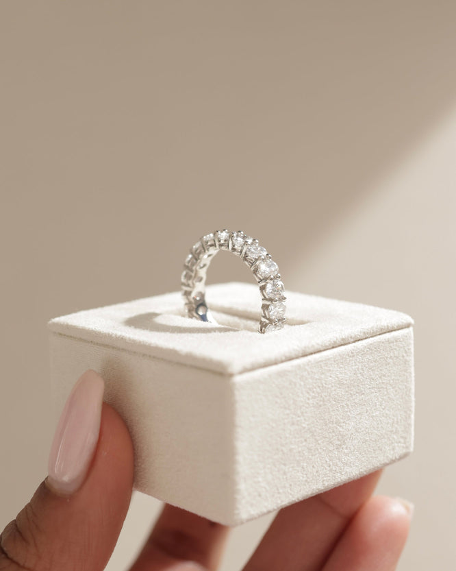 1.35 TCW oval cut moissanite half eternity wedding band β elegant and timeless design crafted in polished gold, perfect for bridal stacking or solo wear.