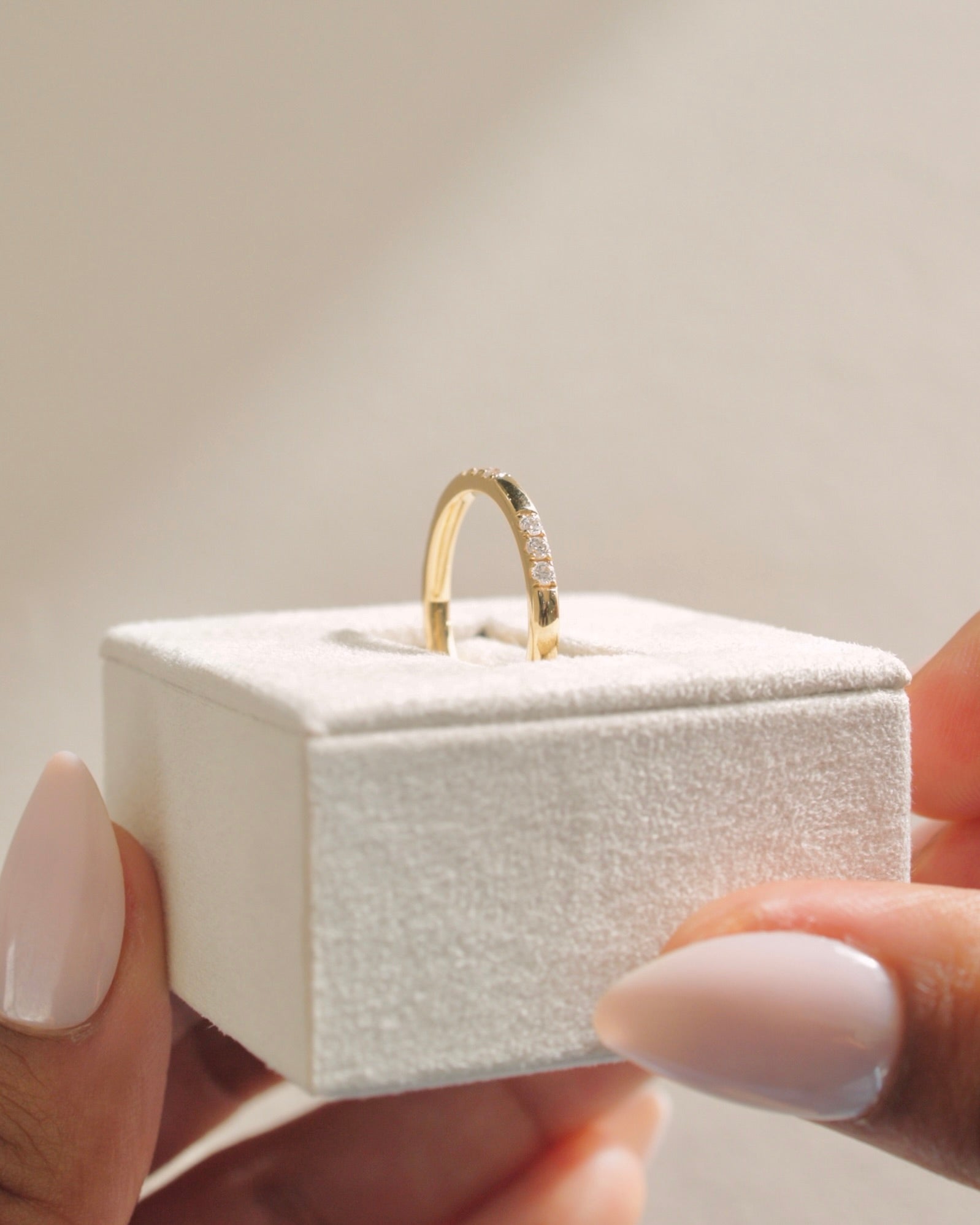 0.31 TCW round cut moissanite wedding band in a clustered pavé setting – delicate and sparkling gold band, perfect for bridal stacking or everyday elegance.