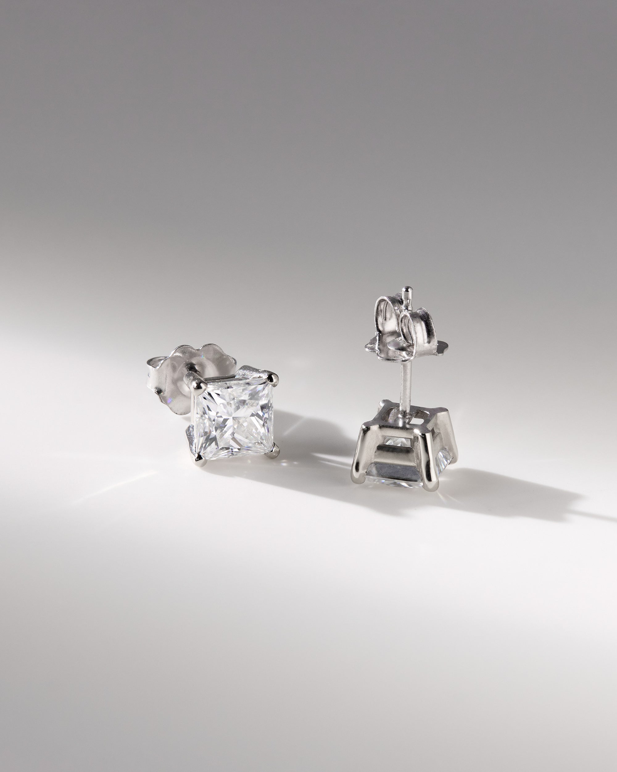 2.00 CT princess cut moissanite earrings in a four-prong setting – sleek and modern gold studs offering brilliant sparkle, perfect for elegant bridal or everyday wear