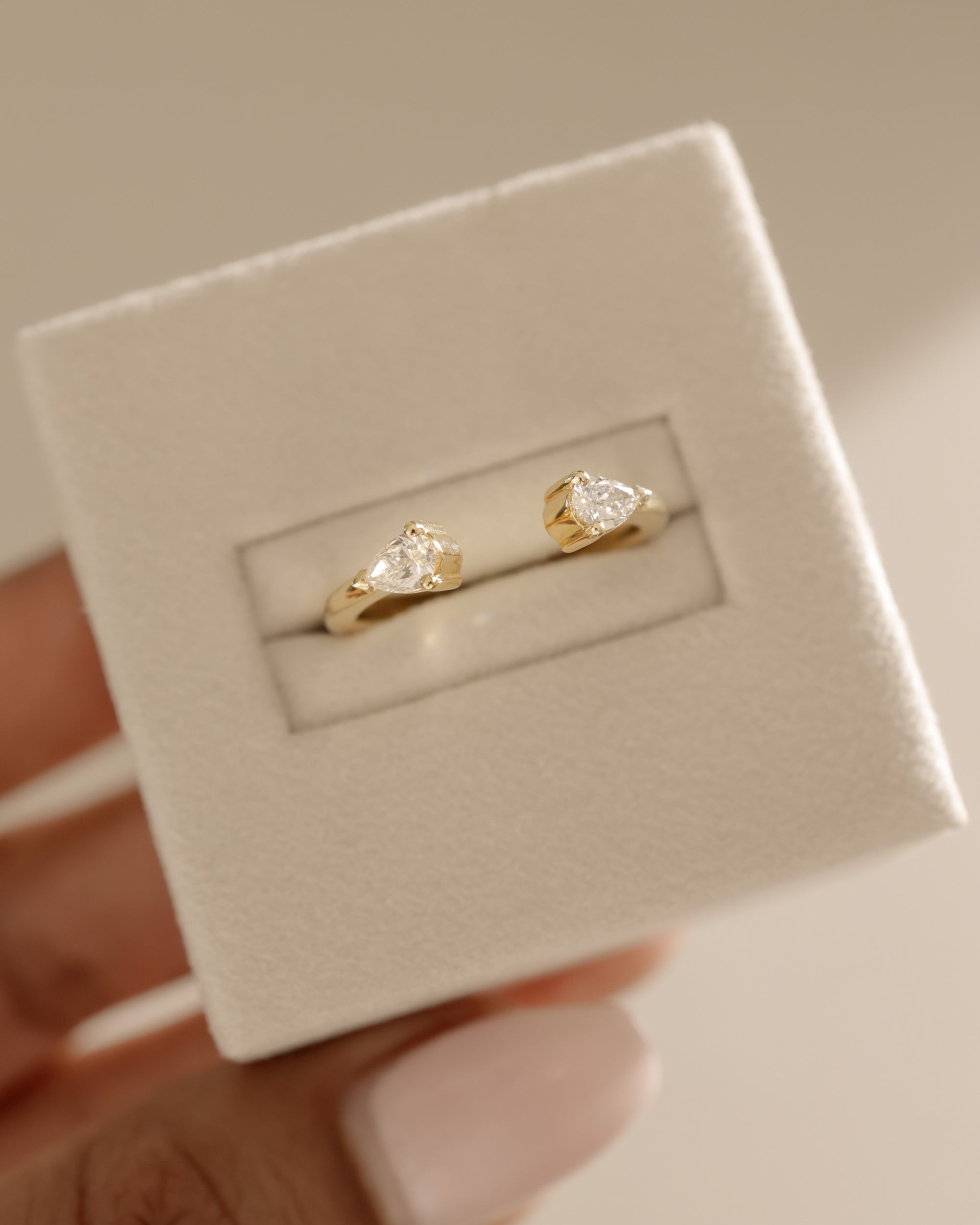 0.5 TCW pear cut moissanite open-style wedding band – modern and elegant design in polished gold, perfect for stacking or pairing with engagement rings.