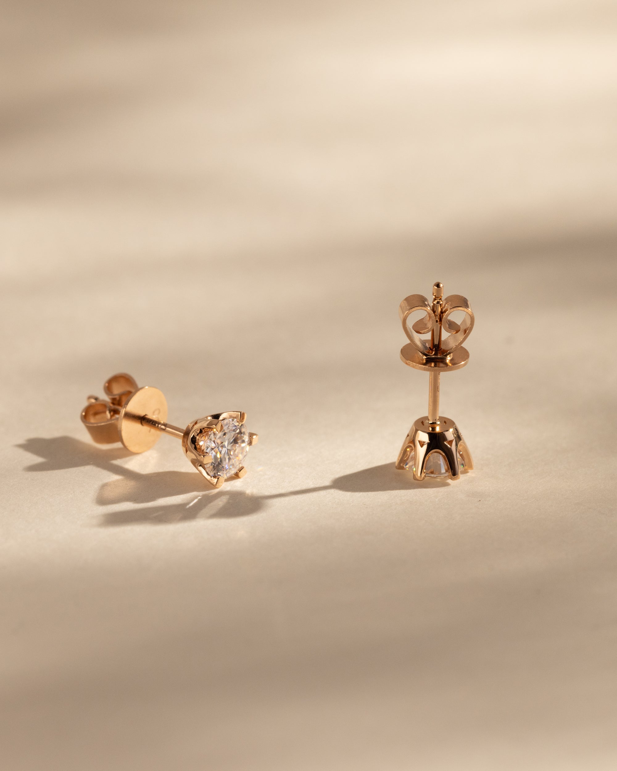 2.00 CT round cut moissanite earrings in a classic four-prong setting – brilliant and elegant gold studs, ideal for bridal sparkle or everyday sophistication.