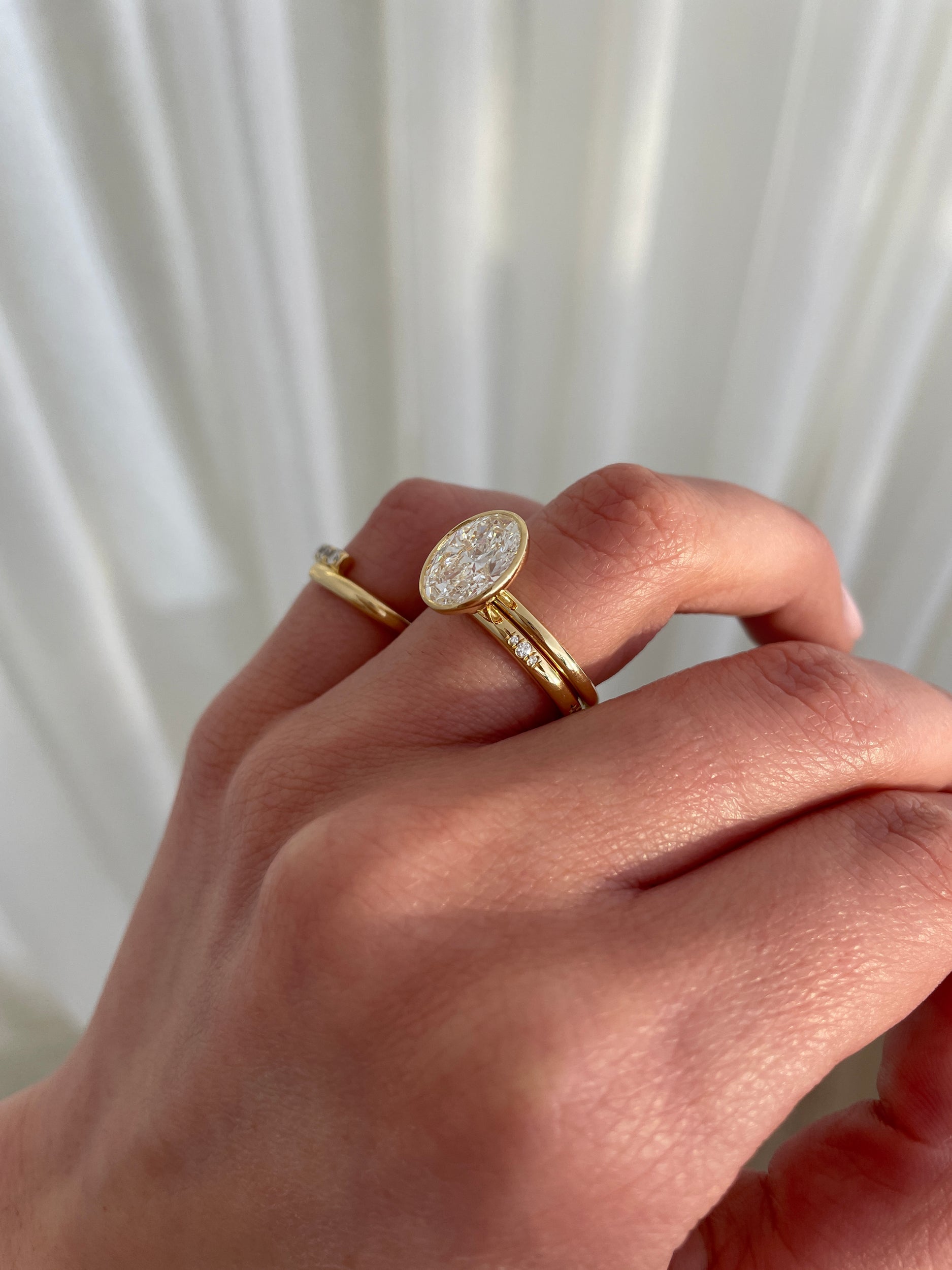 0.10 TCW round cut moissanite flush-set wedding band – sleek and minimalist gold ring with subtle sparkle, ideal for modern bridal or everyday wear.