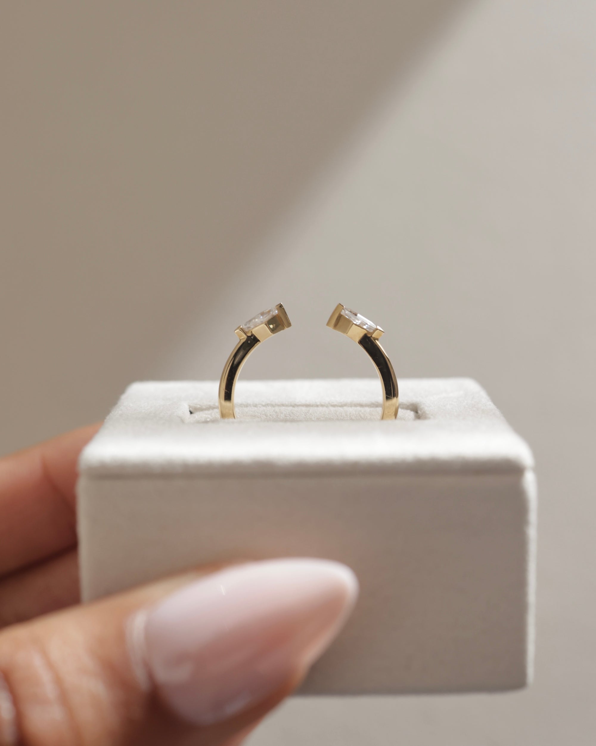 0.4 TCW kite cut moissanite open-style wedding band – contemporary and edgy design in polished gold, perfect for stacking or pairing with statement engagement rings.