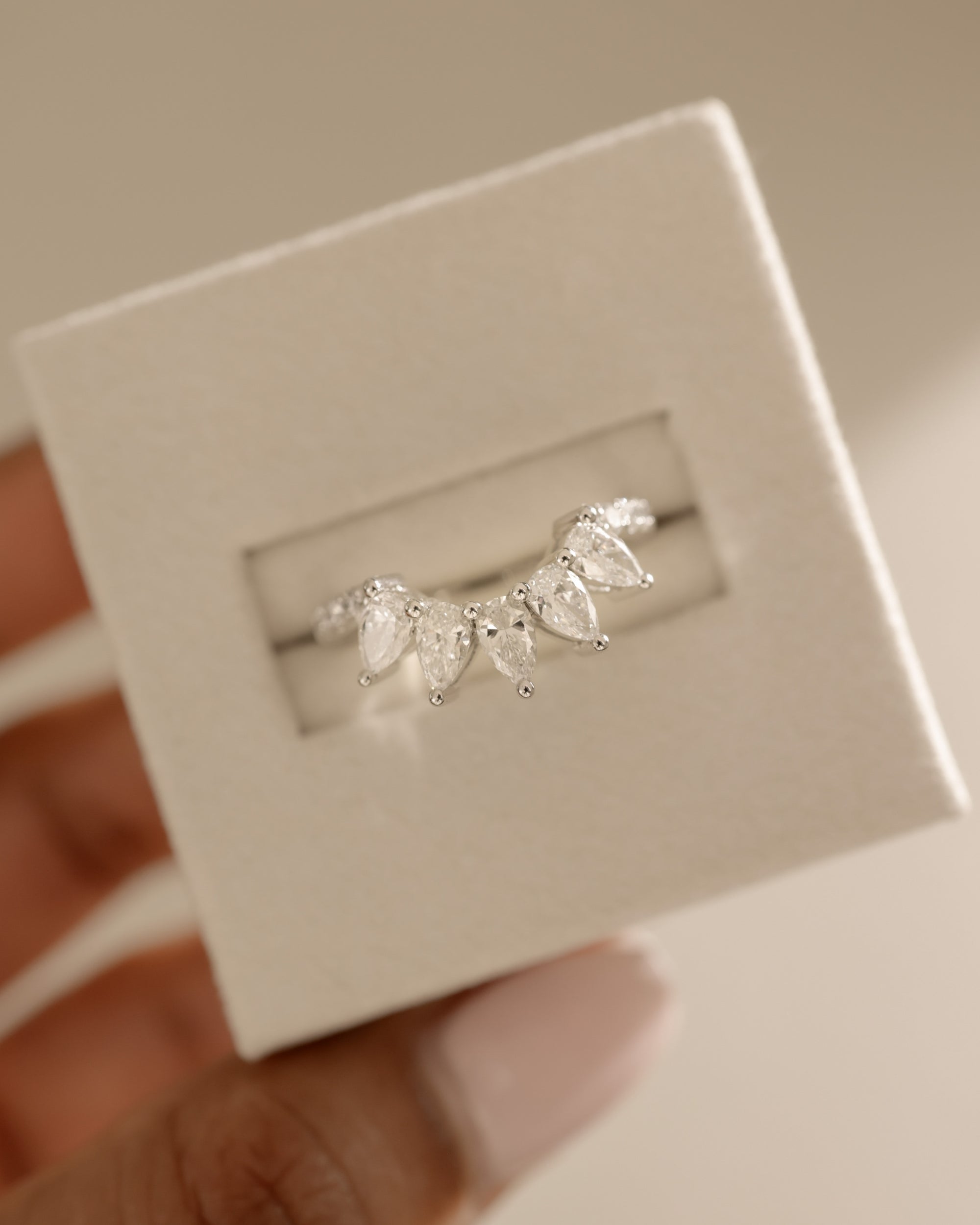 1.49 TCW pear and round cut moissanite wedding band in a bold crown-style design – dazzling, statement bridal ring crafted in polished gold for a regal look.