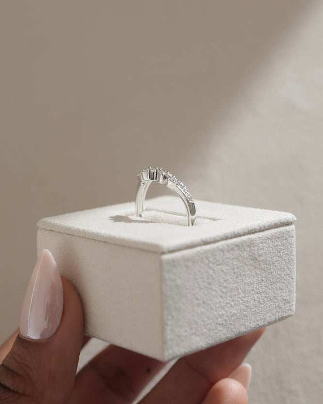 0.27 TCW round cut moissanite wedding band in a crown-inspired design β dainty and elegant ring crafted in polished gold, ideal for bridal stacking.