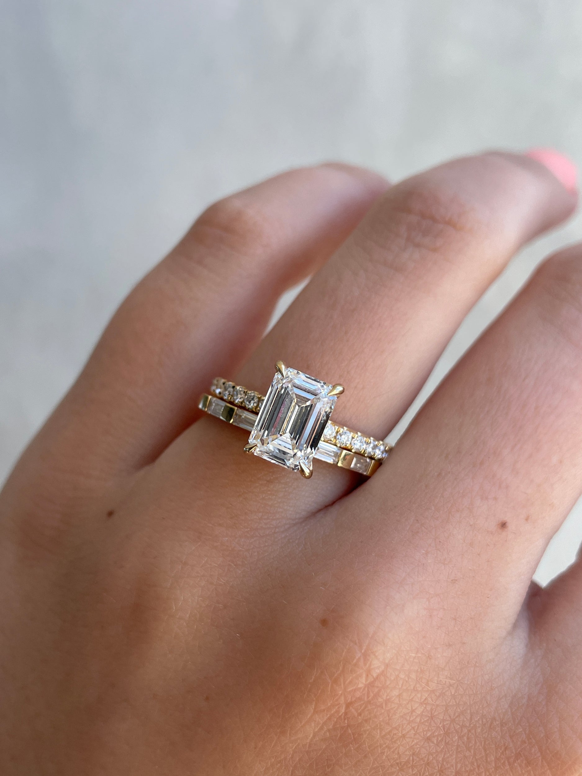 0.32 TCW baguette cut moissanite half eternity wedding band – sleek and modern gold ring featuring step-cut stones, perfect for stacking or contemporary bridal wear.