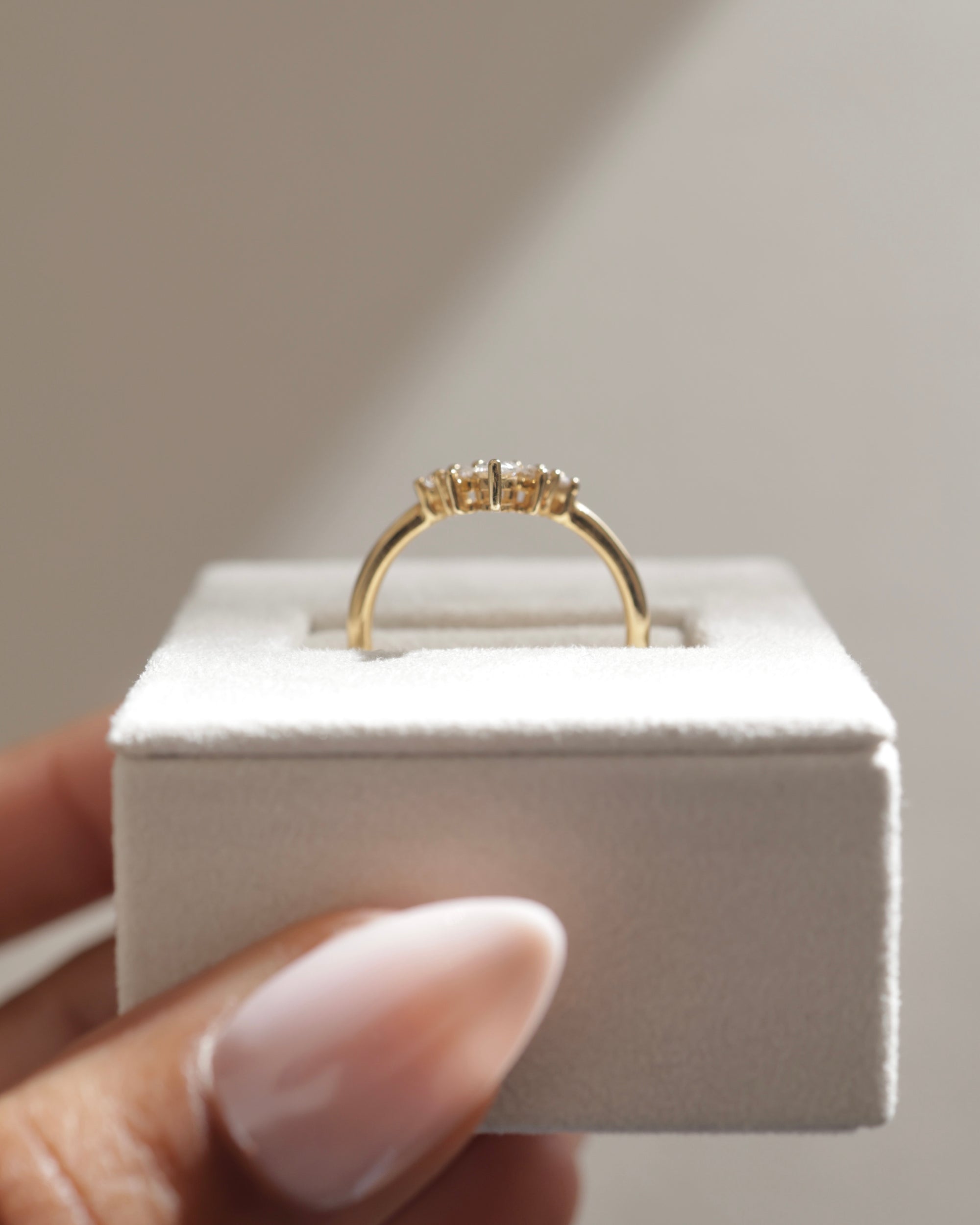 0.37 TCW moissanite bridal wedding band featuring round and pear cut stones in a crown-inspired design – elegant, sparkling ring crafted in polished gold.