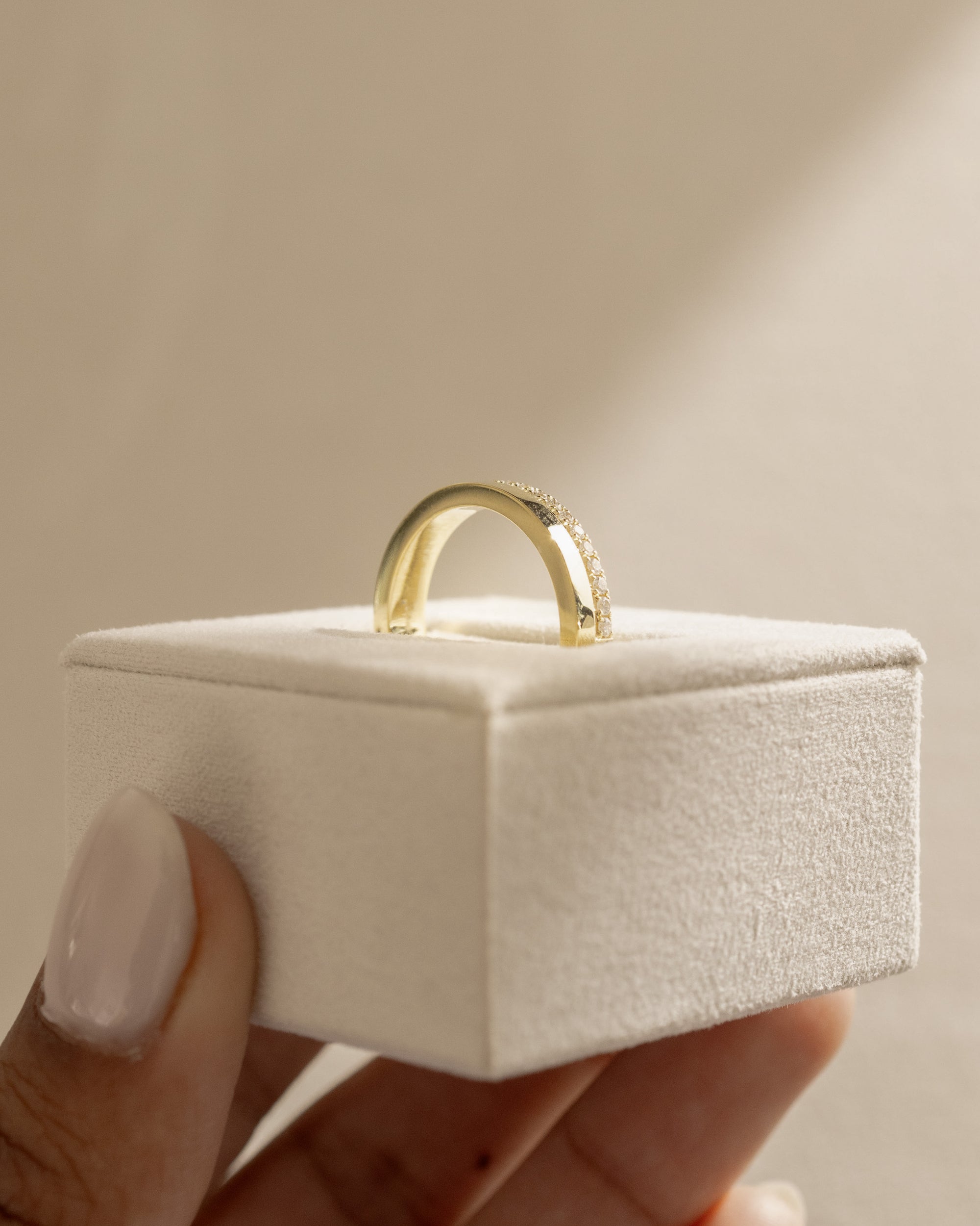 0.21 TCW round cut moissanite pavé wedding band in a bold cigar-style design – wide gold band with delicate sparkle, perfect for modern bridal or statement wear.