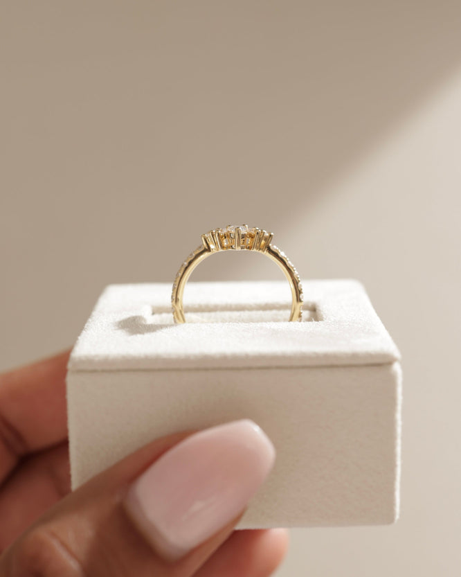 0.27 TCW pear and round cut moissanite crown-style wedding band β elegant curved design in polished gold, perfect for bridal sets or stacking with engagement rings.