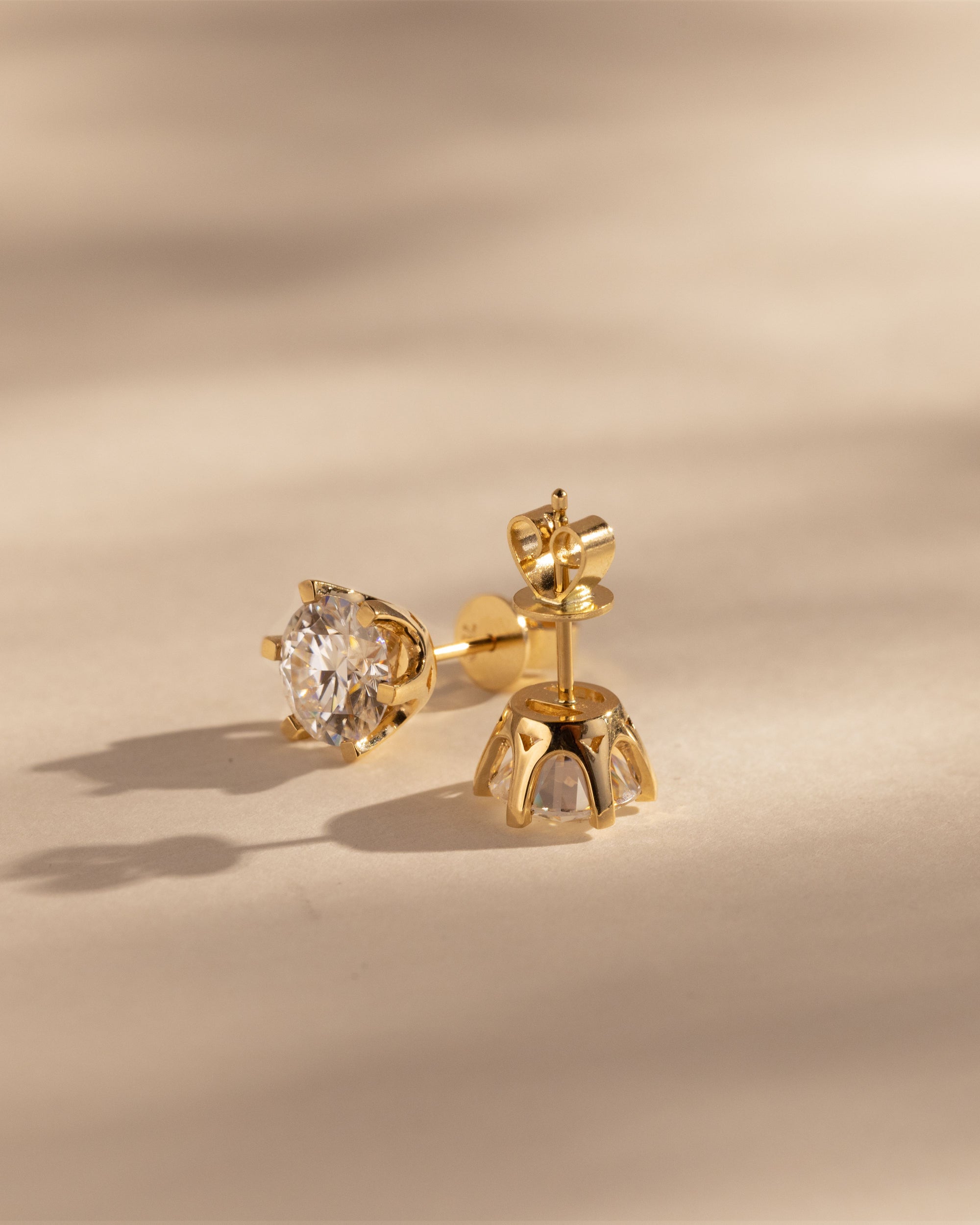 2.00 CT round cut moissanite earrings in a classic four-prong setting – brilliant and elegant gold studs, ideal for bridal sparkle or everyday sophistication.