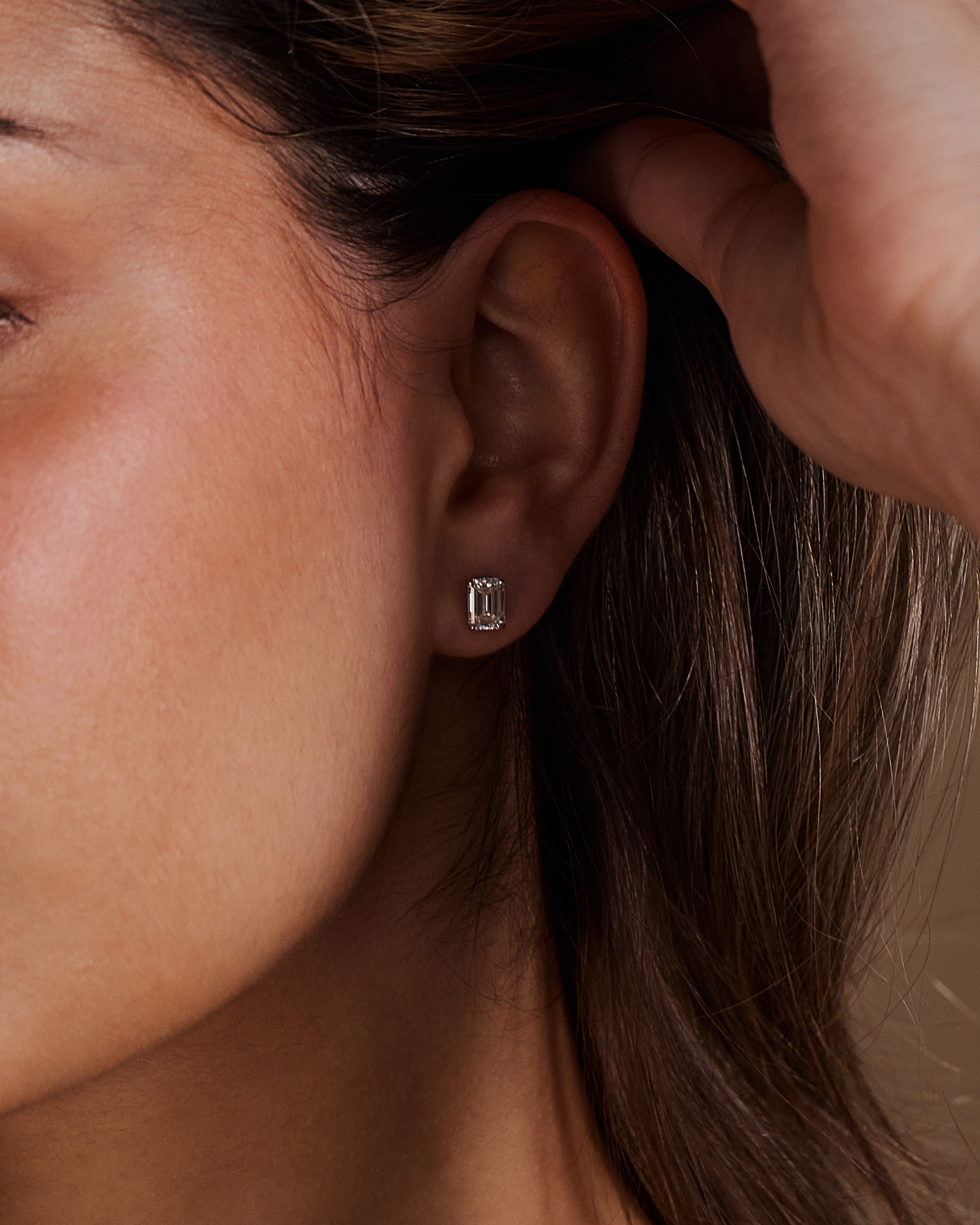 2.00 TCW emerald cut moissanite stud earrings – timeless and elegant diamond alternative set in polished gold, perfect for everyday luxury or special occasions.