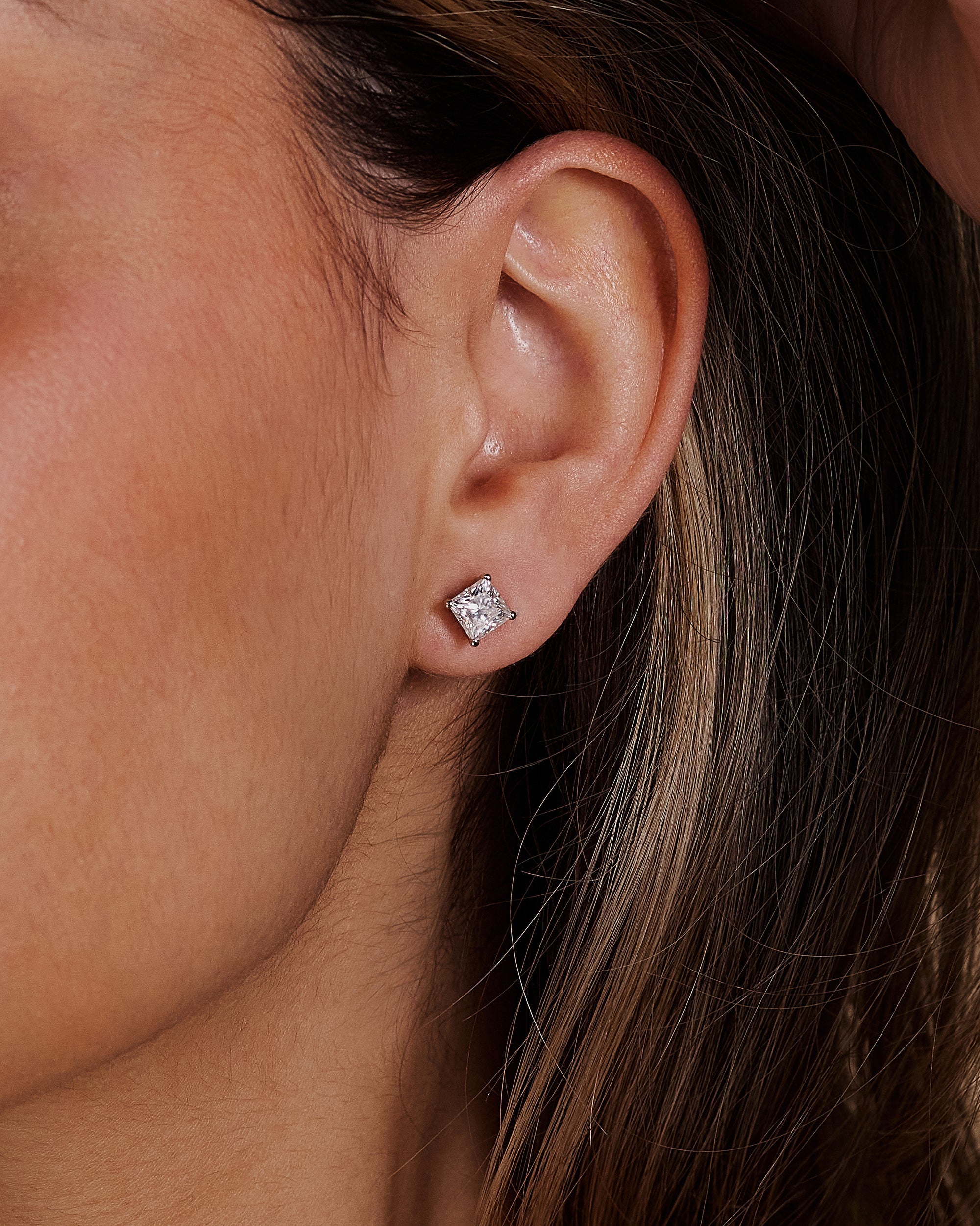 2.00 CT princess cut moissanite earrings in a four-prong setting – sleek and modern gold studs offering brilliant sparkle, perfect for elegant bridal or everyday wear