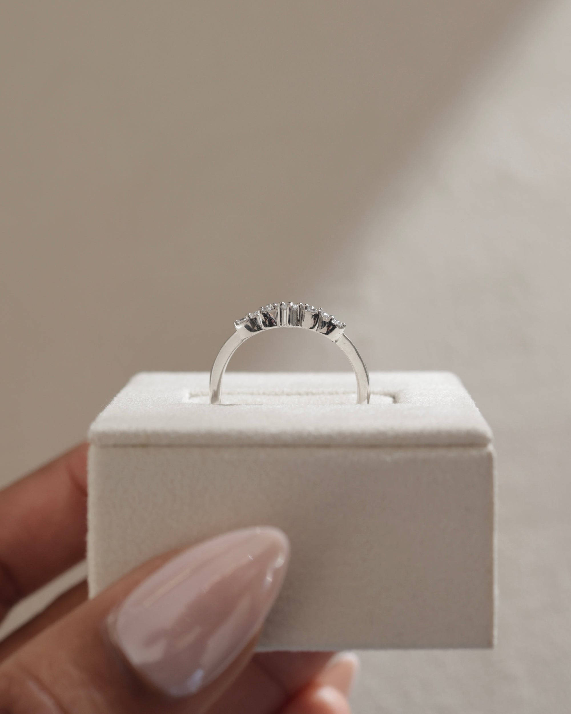 0.27 TCW round cut moissanite wedding band in a crown-inspired design – dainty and elegant ring crafted in polished gold, ideal for bridal stacking.