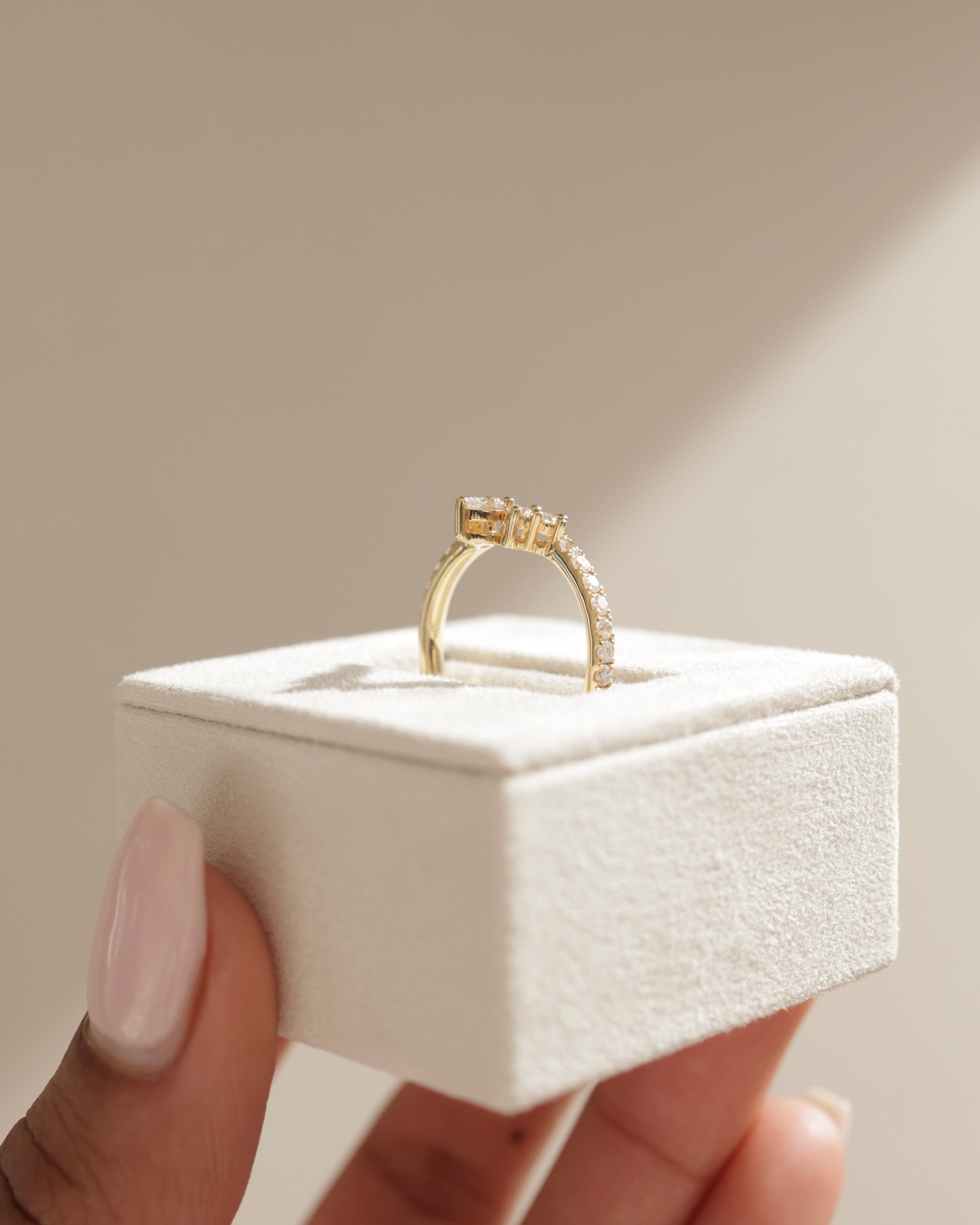 0.27 TCW pear and round cut moissanite crown-style wedding band – elegant curved design in polished gold, perfect for bridal sets or stacking with engagement rings.