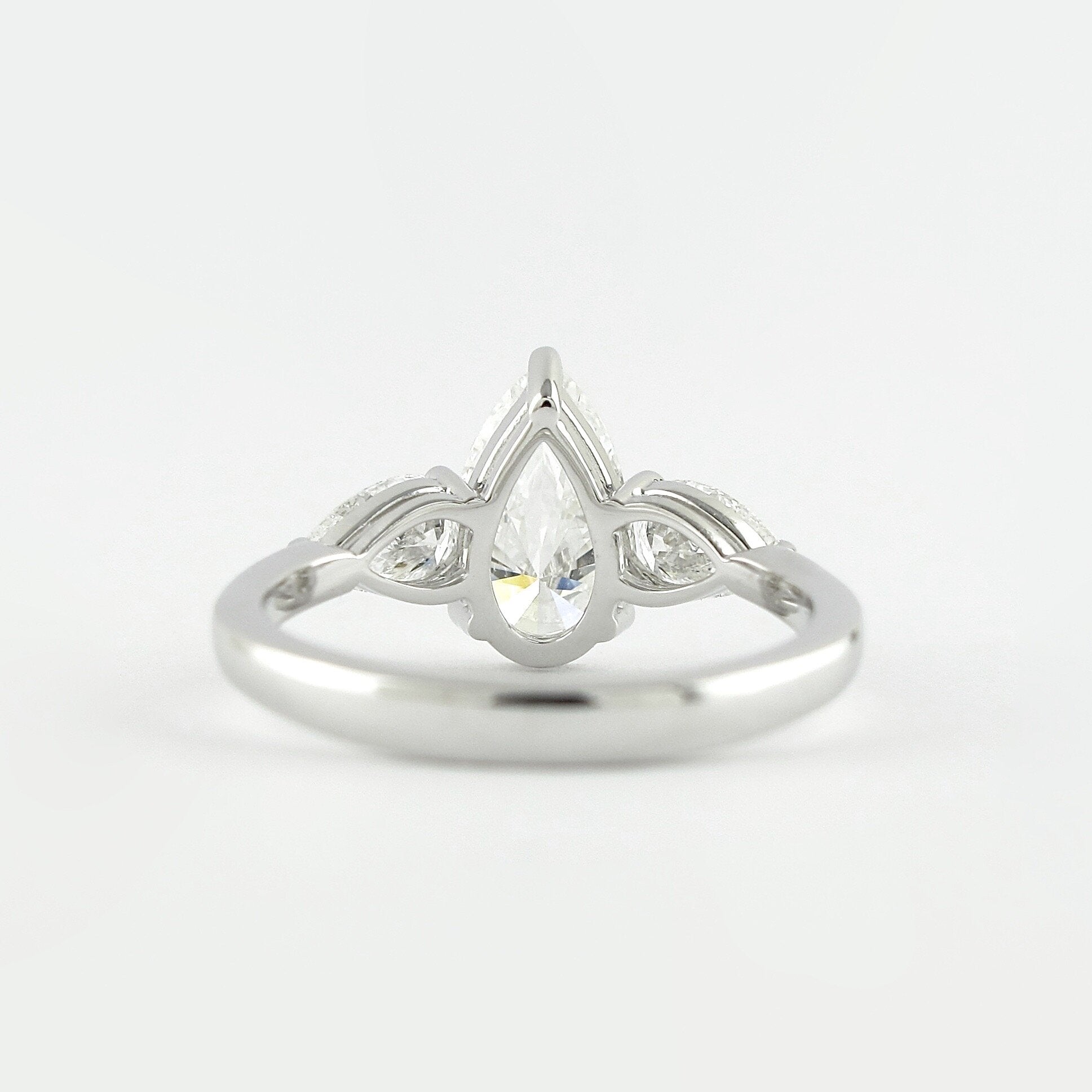 1.50 CT Pear Cut Three Stone Style Moissanite Engagement Ring - crownmoissanite