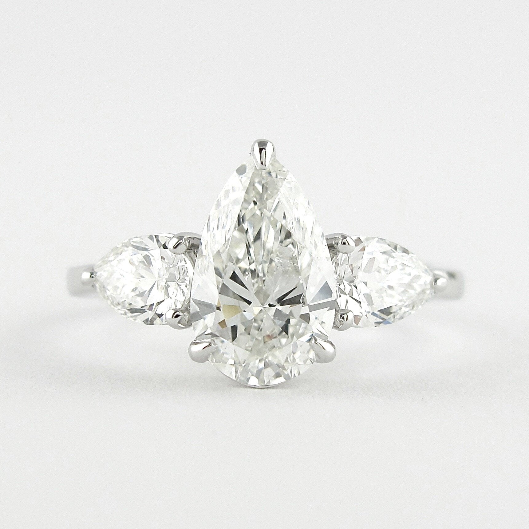 1.50 CT Pear Shaped Moissanite Three Stones Engagement Ring - crownmoissanite