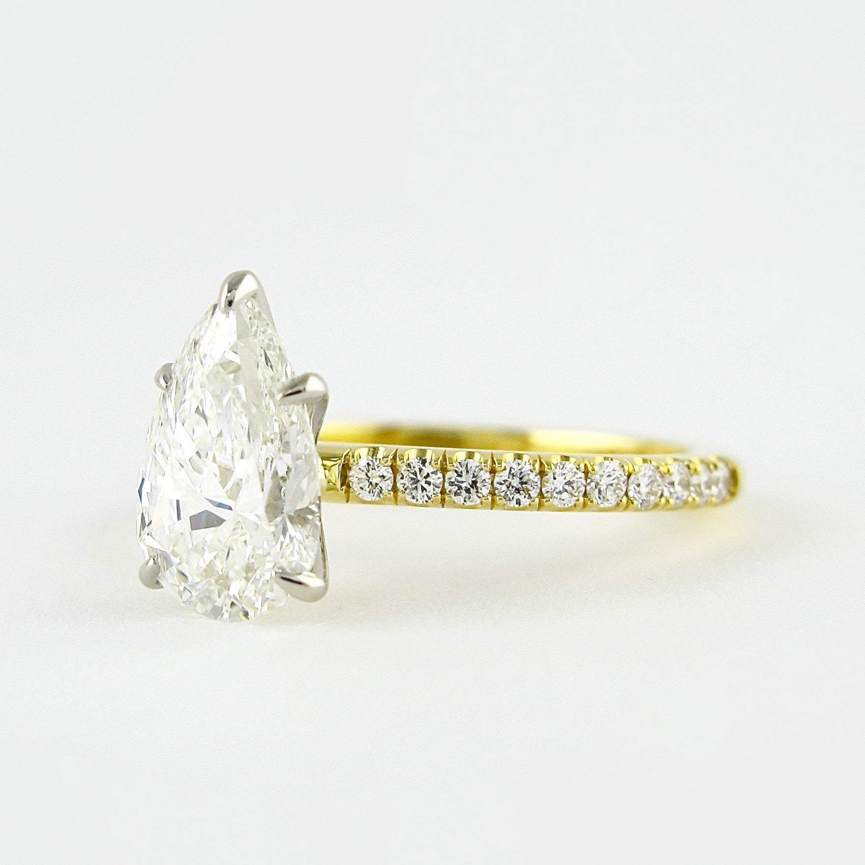 0.94 CT Pear Solitaire & Pave Setting Moissanite Engagement Ring - crownmoissanite