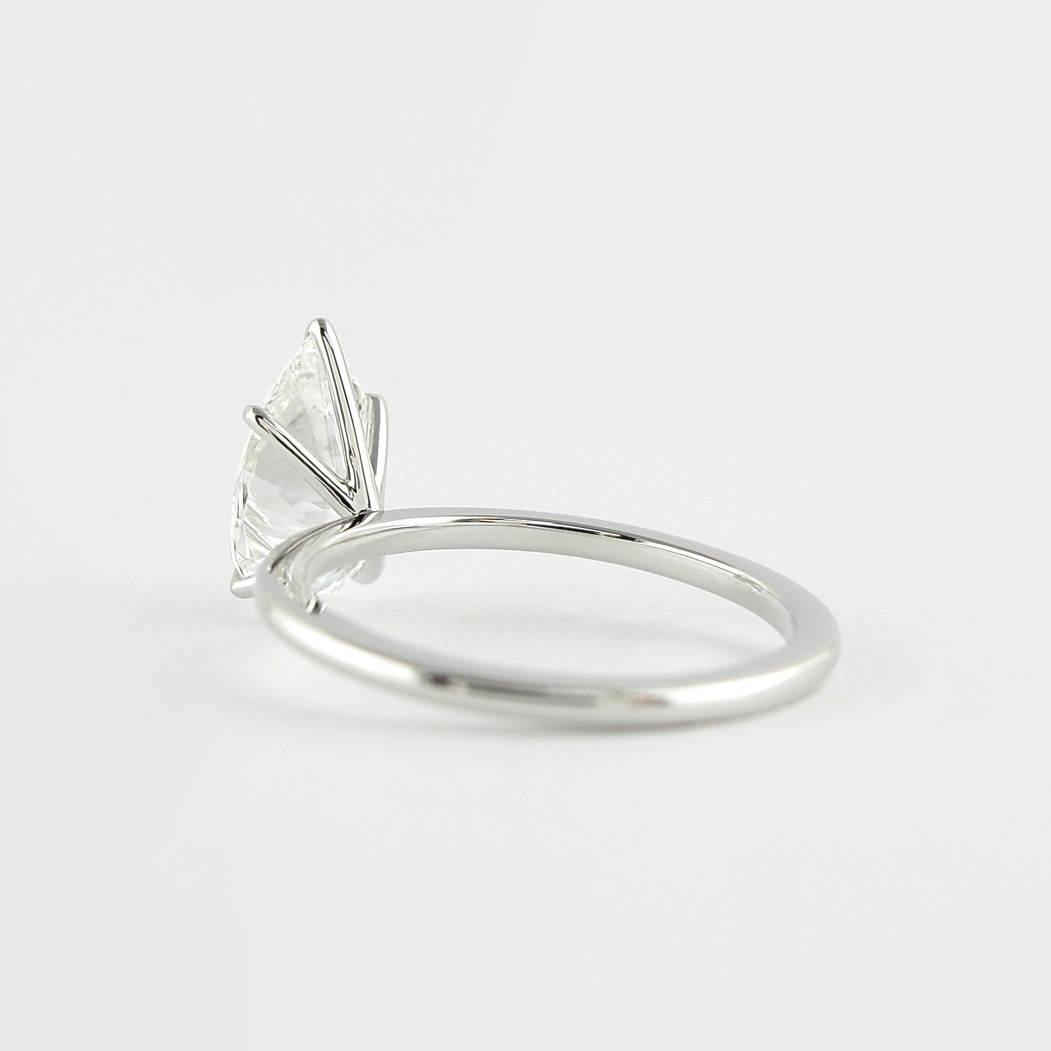 1.5 CT Pear Cut Solitaire Style Moissanite Engagement Ring - crownmoissanite