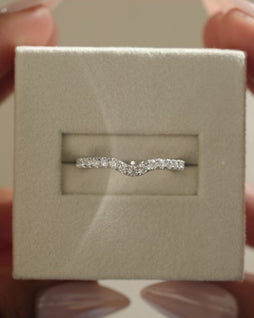 0.39 TCW round cut moissanite curved wedding band – gracefully contoured design crafted in polished gold, ideal for pairing with solitaire engagement rings.