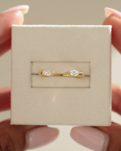 0.3 TCW marquise cut moissanite open-style wedding band – sleek and modern design crafted in polished gold, ideal for stacking or matching with engagement rings.