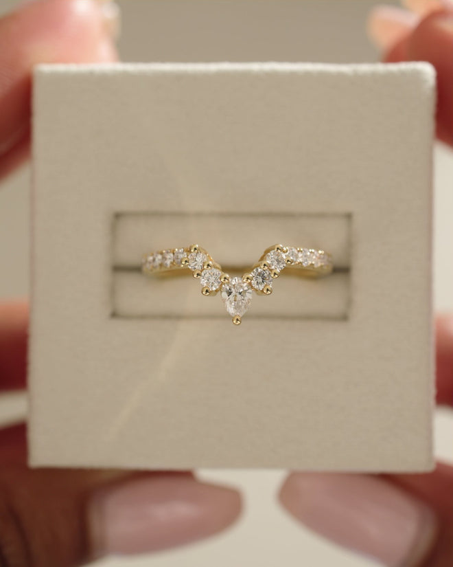 0.27 TCW pear and round cut moissanite crown-style wedding band – elegant curved design in polished gold, perfect for bridal sets or stacking with engagement rings.