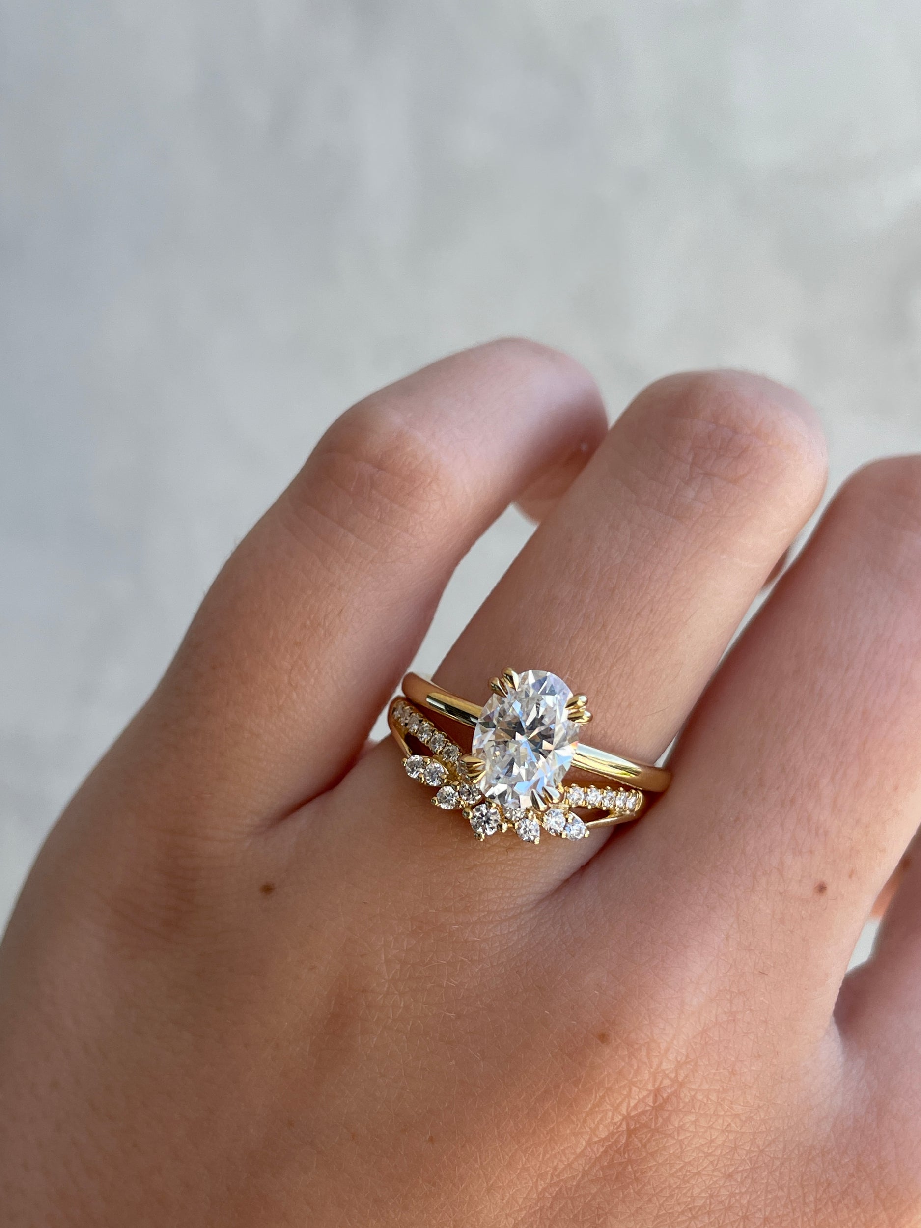 0.27 TCW round cut moissanite wedding band in a crown-inspired design – dainty and elegant ring crafted in polished gold, ideal for bridal stacking.