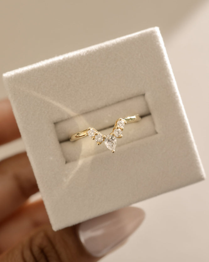 0.37 TCW moissanite bridal wedding band featuring round and pear cut stones in a crown-inspired design – elegant, sparkling ring crafted in polished gold.