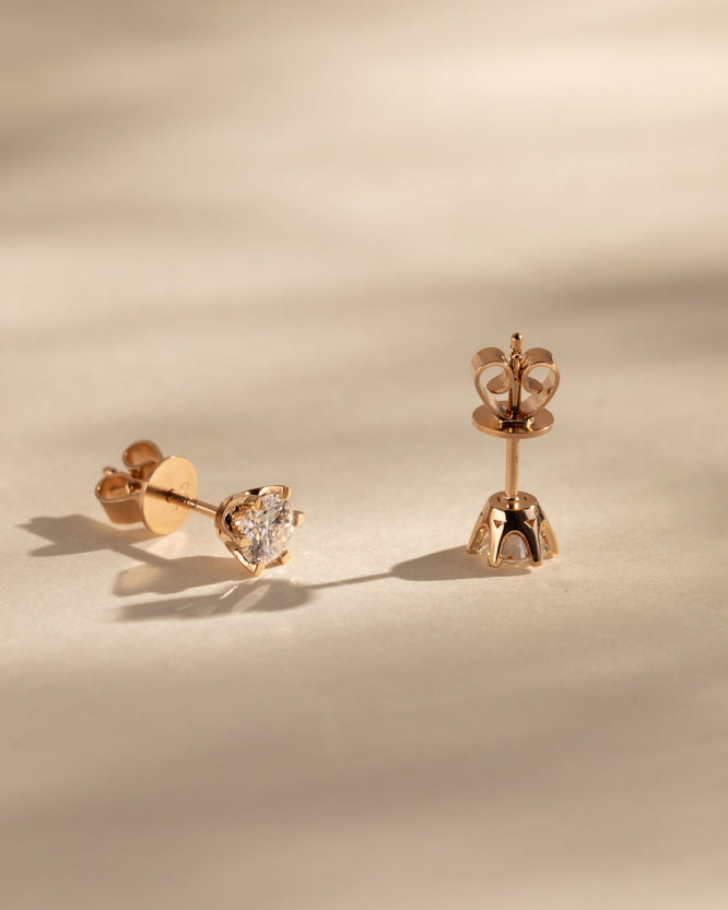 2.00 CT round cut moissanite earrings in a classic four-prong setting – brilliant and elegant gold studs, ideal for bridal sparkle or everyday sophistication.

