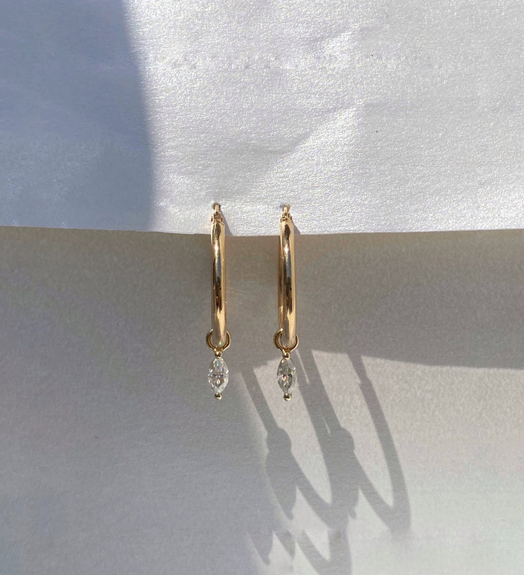 2.00 CT marquise cut moissanite diamond hoop earrings – stylish and elegant gold hoops featuring elongated marquise stones, perfect for bridal glamour or evening wear.