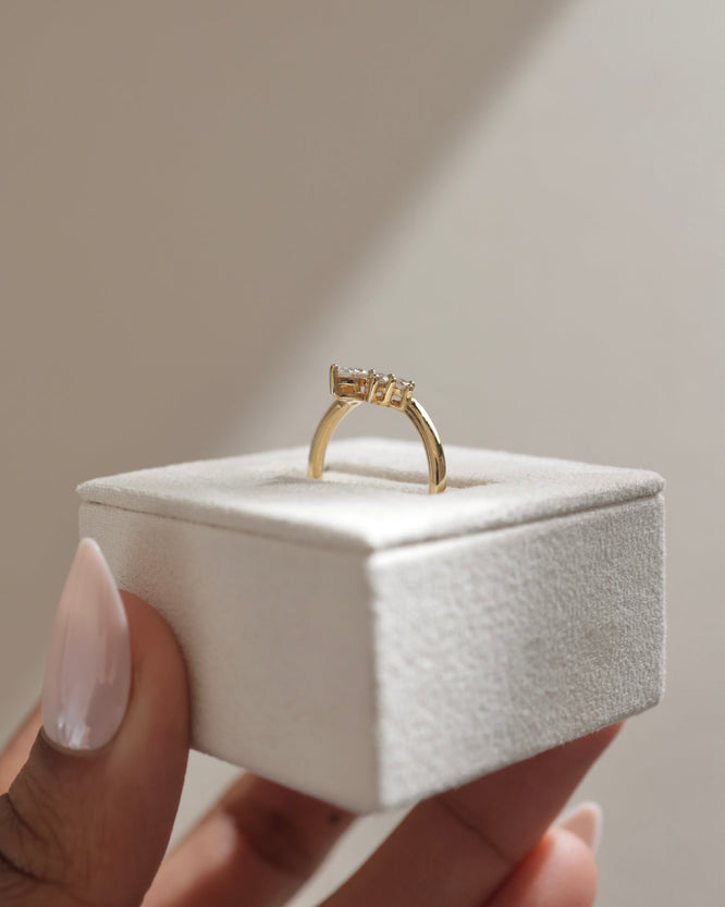 0.37 TCW moissanite bridal wedding band featuring round and pear cut stones in a crown-inspired design – elegant, sparkling ring crafted in polished gold.