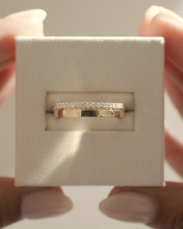 0.21 TCW round cut moissanite pavé wedding band in a bold cigar-style design – wide gold band with delicate sparkle, perfect for modern bridal or statement wear.