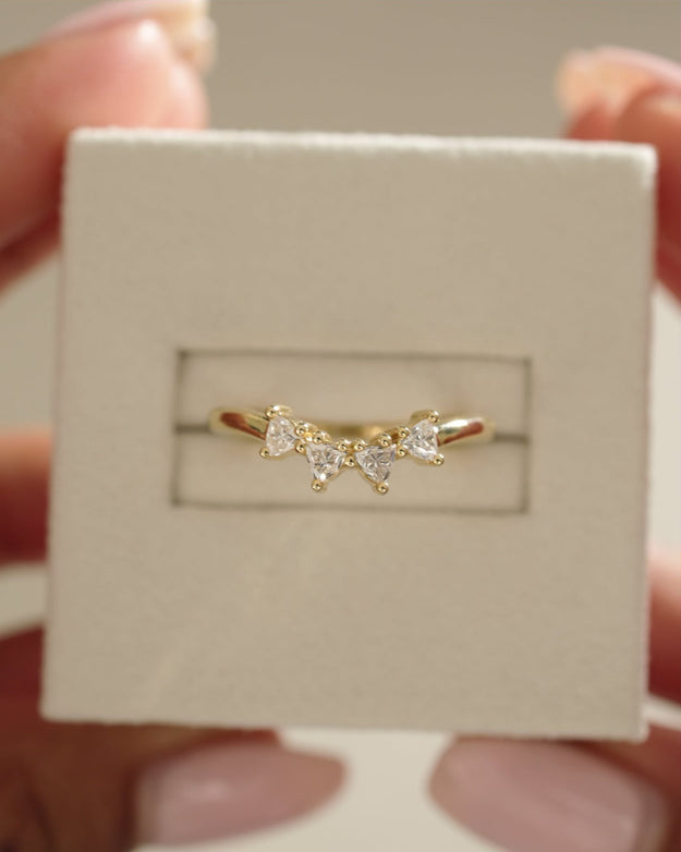 0.48 TCW trillion cut moissanite curved wedding band – unique and modern contour design in polished gold, perfect for stacking with engagement rings or wearing solo.