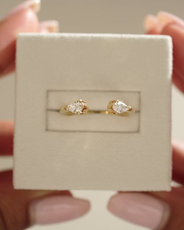 0.5 TCW pear cut moissanite open-style wedding band – modern and elegant design in polished gold, perfect for stacking or pairing with engagement rings.